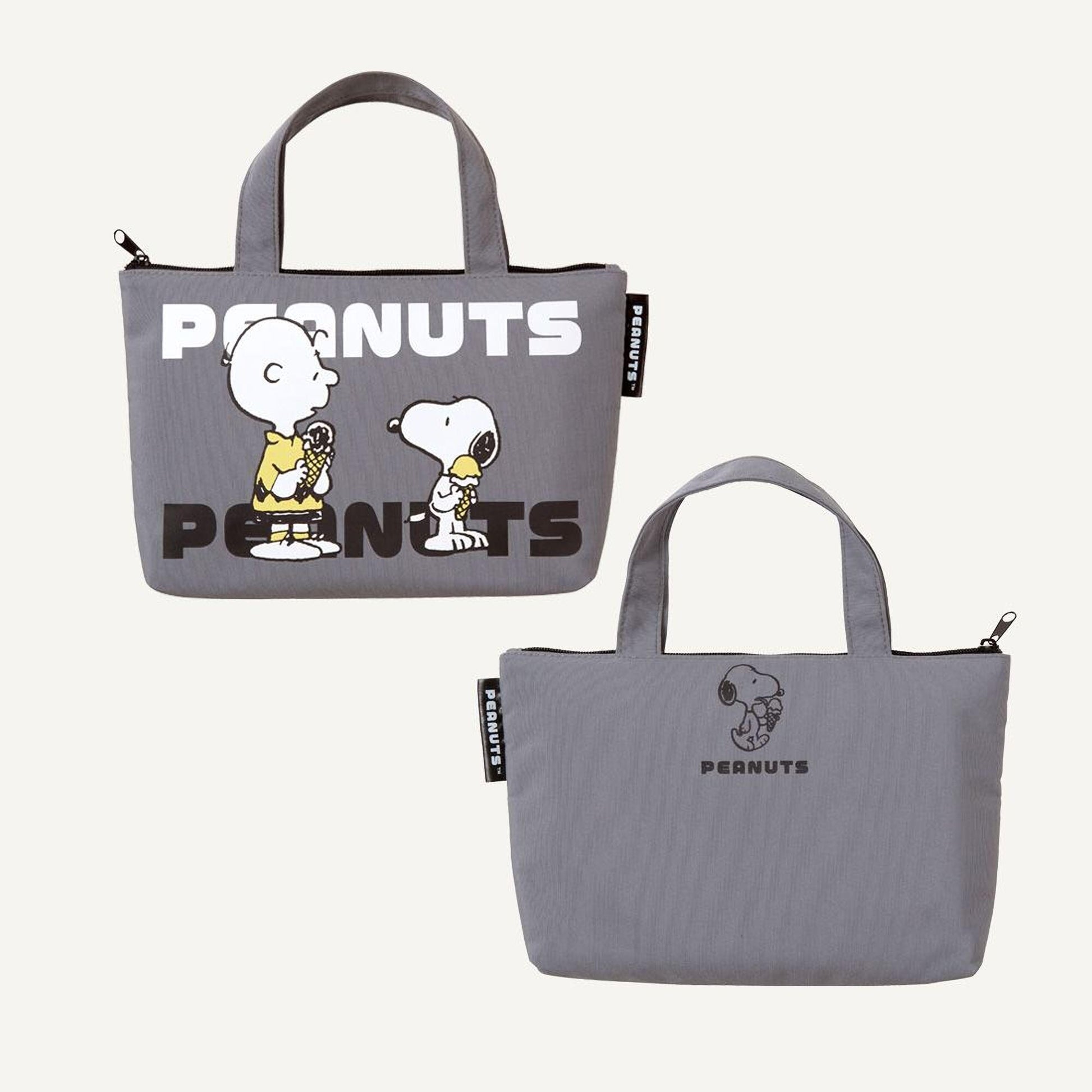 two gray tote bags with the Peanuts logo printed on them.