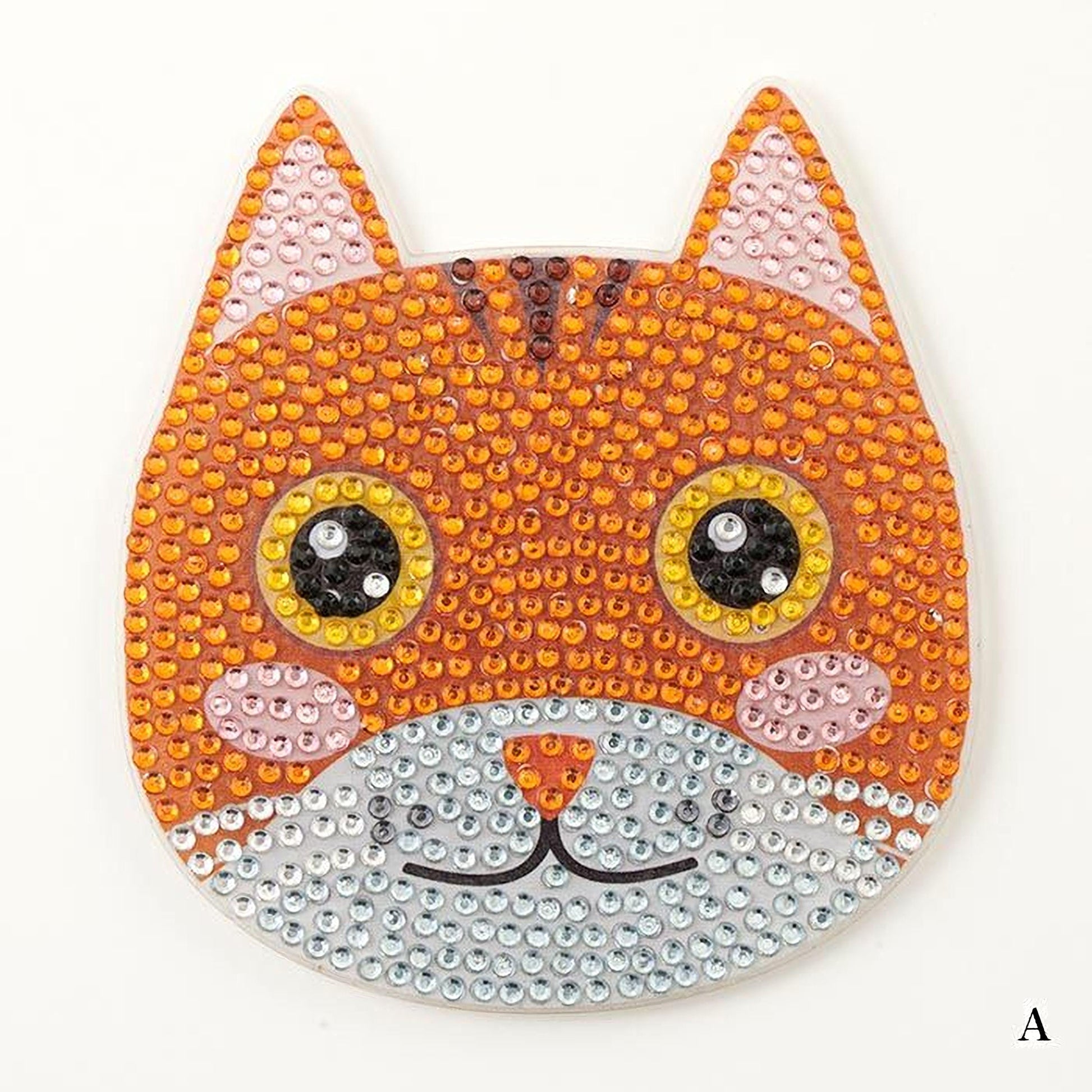 A cat-shaped object made of small, colorful beads or sequins, with large eyes and a small nose.