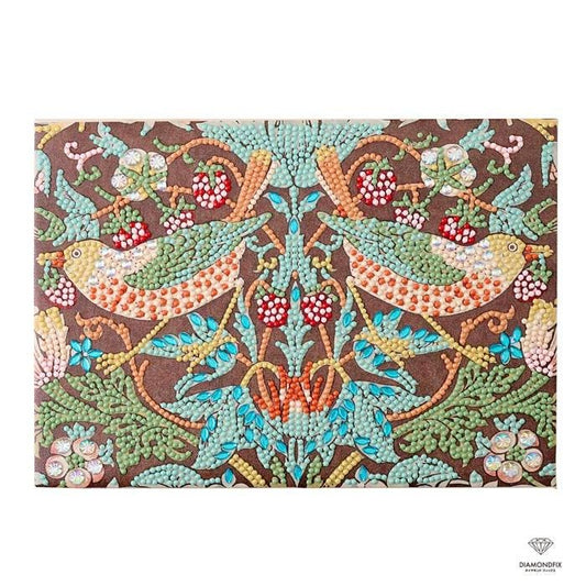 The image is a vibrant and intricate embroidered design featuring two birds, possibly cherubs, surrounded by a variety of colorful flowers and leaves. The design is composed of numerous small dots, creating a detailed and visually striking pattern.