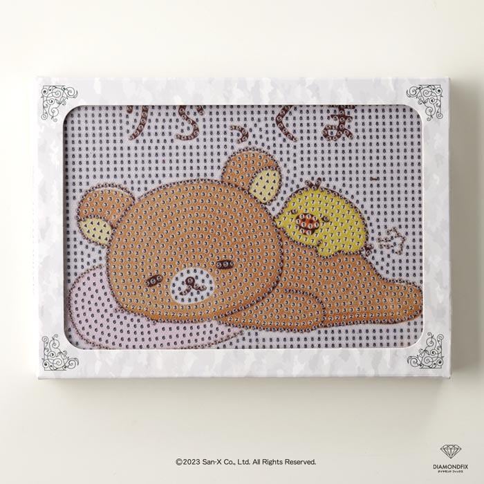 A framed image depicting a teddy bear and a yellow bird, with the text "Kawaii" visible.