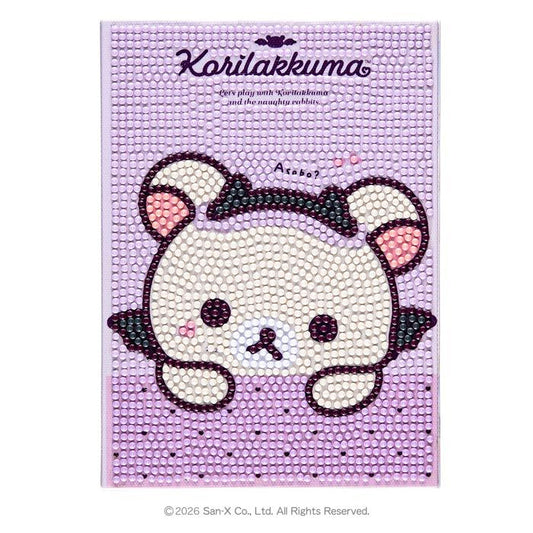 A purple background with a cartoon-like bear design made of small, colorful beads.