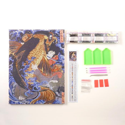 a diamond-studded embroidery kit, which includes a kit with a diamond pattern, a kit with a fish pattern, and a kit with a flower pattern. There are also some tools and supplies for working with the kit, such as a magnifying glass, a pair of scissors, and a ruler.