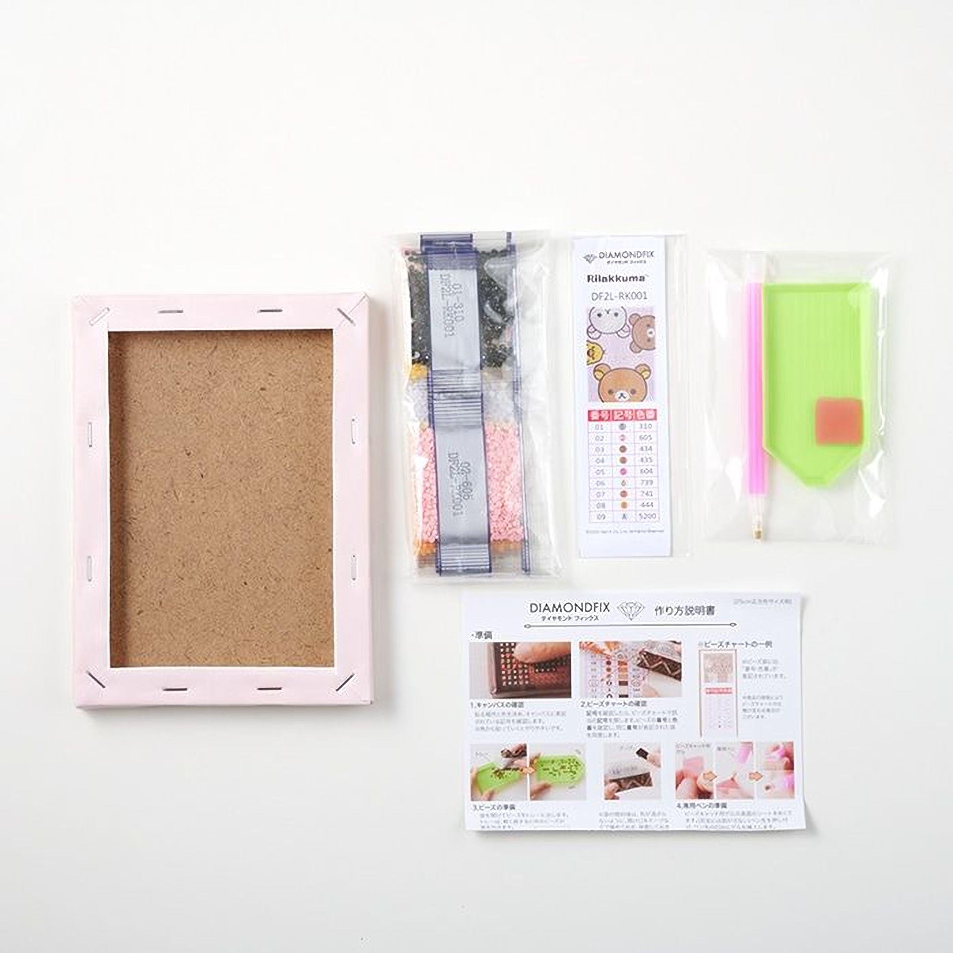 various items related to diamond painting, including a pink frame, a diamond kit, a diamond kit with a guide, and a diamond kit with a guide.