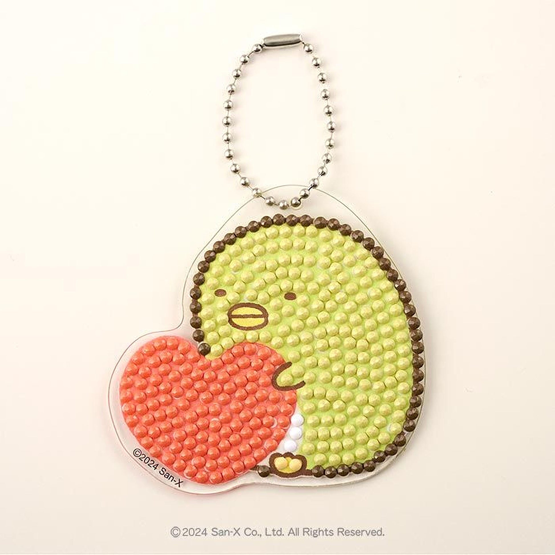 A keychain with a heart-shaped design made of small beads in green and red colors.