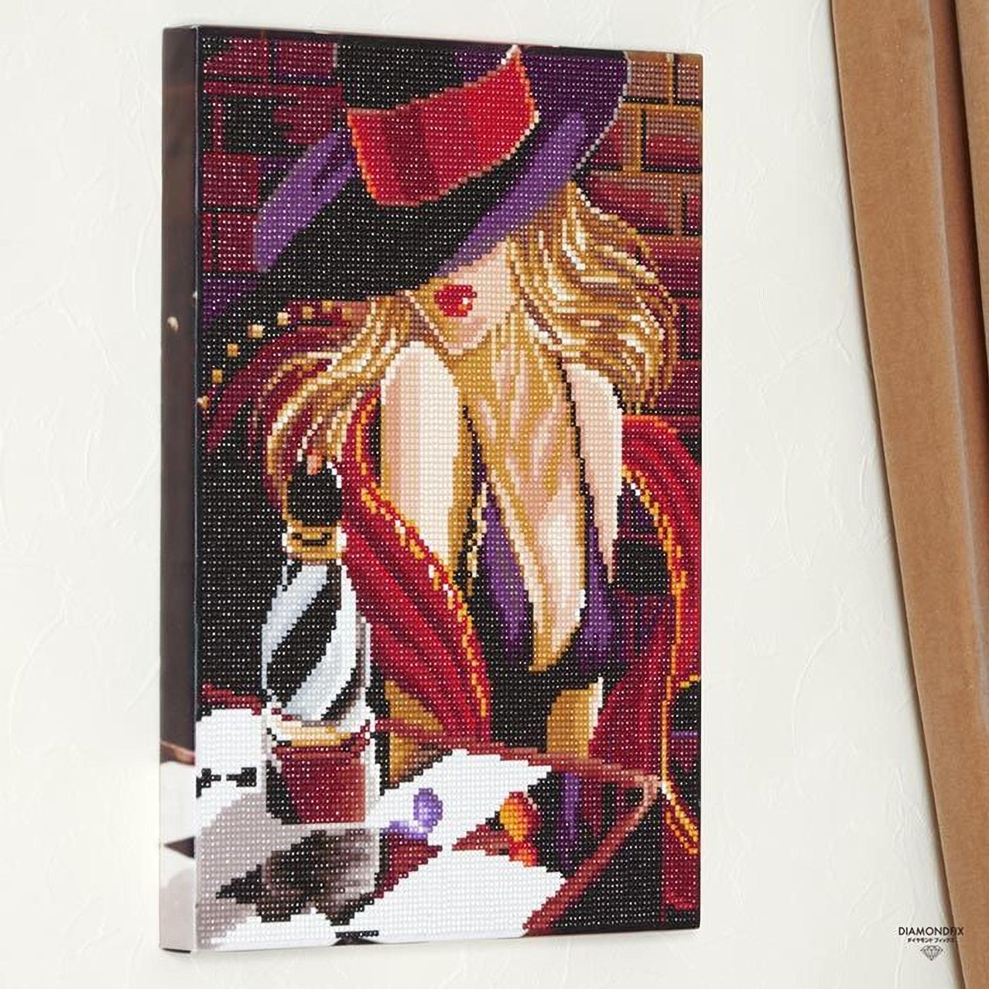 The image is a diamond-studded embroidery or cross-stitch artwork depicting a woman wearing a purple hat and a red dress, with a bottle of perfume in the background.