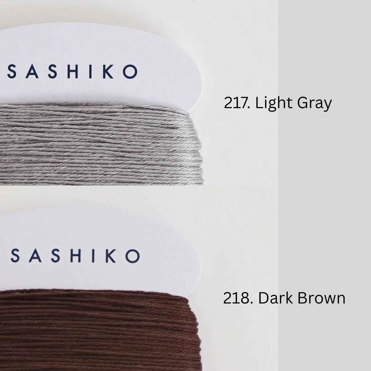 two spools of thread, each with a different color and labeled accordingly. The left spool has a light gray color and is labeled "SASHIKO" while the right spool has a dark brown color and is labeled "218. Dark Brown".