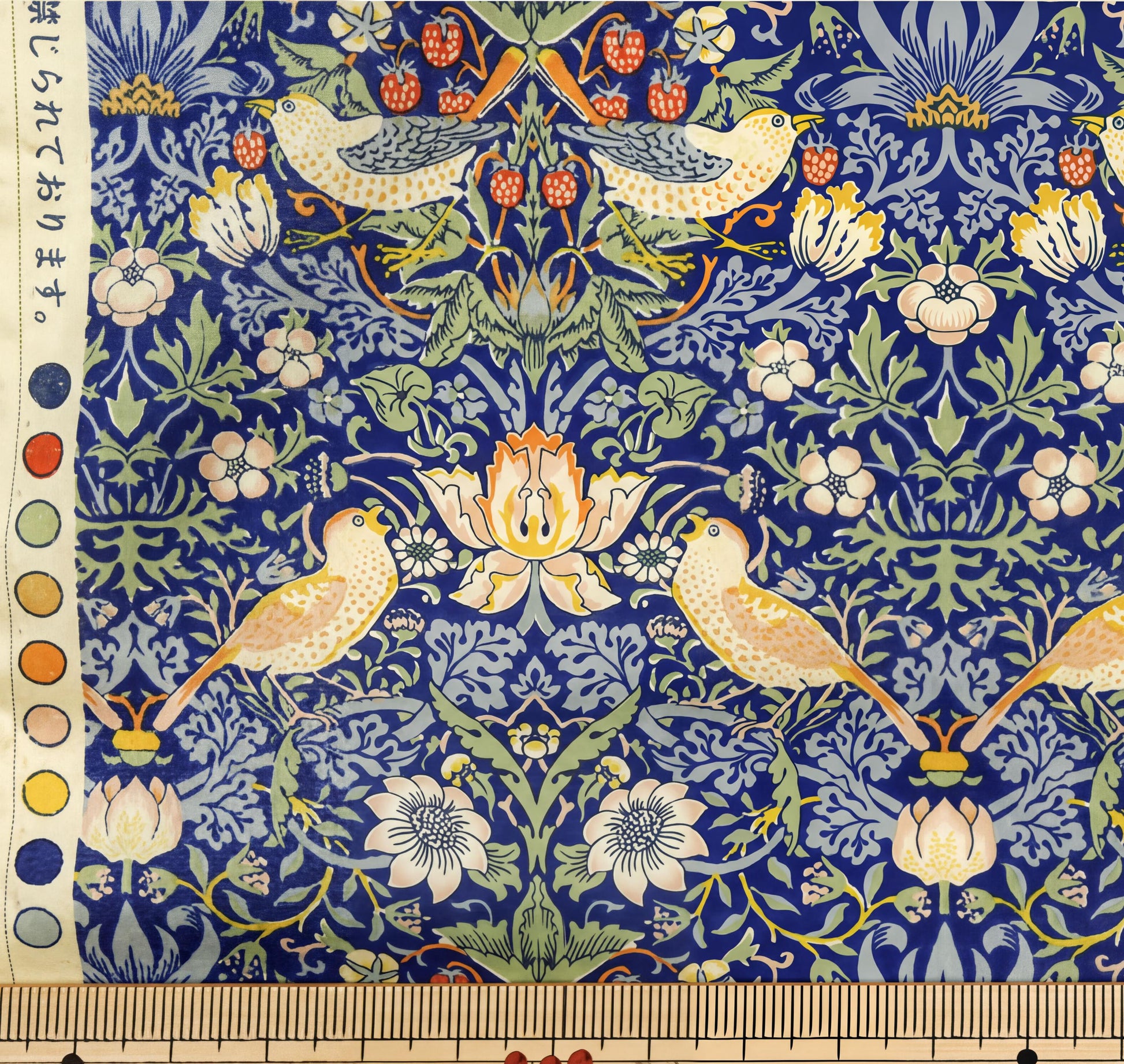 a vibrant and intricate floral pattern with birds and flowers in shades of blue, green, and yellow. The pattern is detailed and visually appealing, showcasing the artist's skill and creativity.