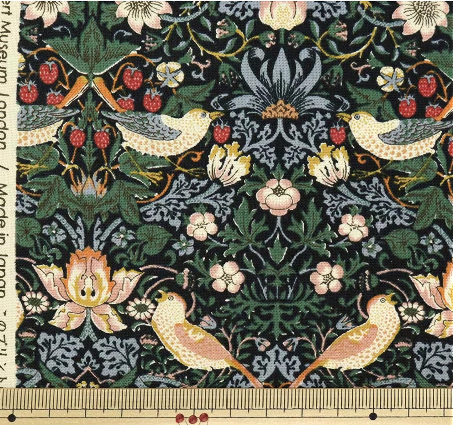 a detailed tapestry with a floral and bird motif, showcasing a variety of flowers, leaves, and birds. The tapestry is rich in color and intricate patterns, creating a visually striking and captivating piece of art.