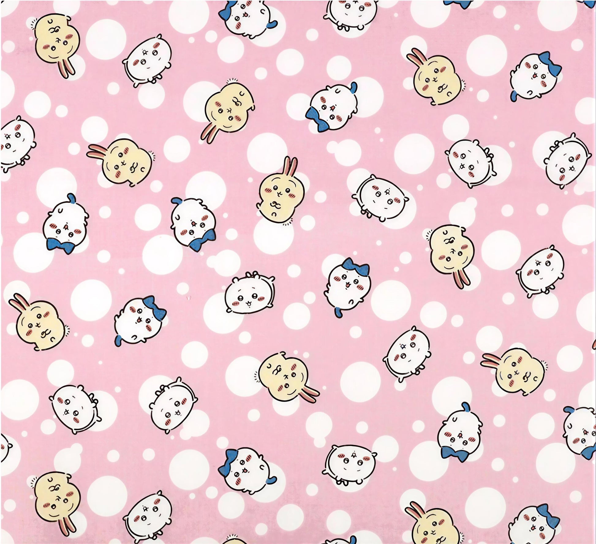 a repeating pattern of cartoon rabbit faces on a pink background with white polka dots.