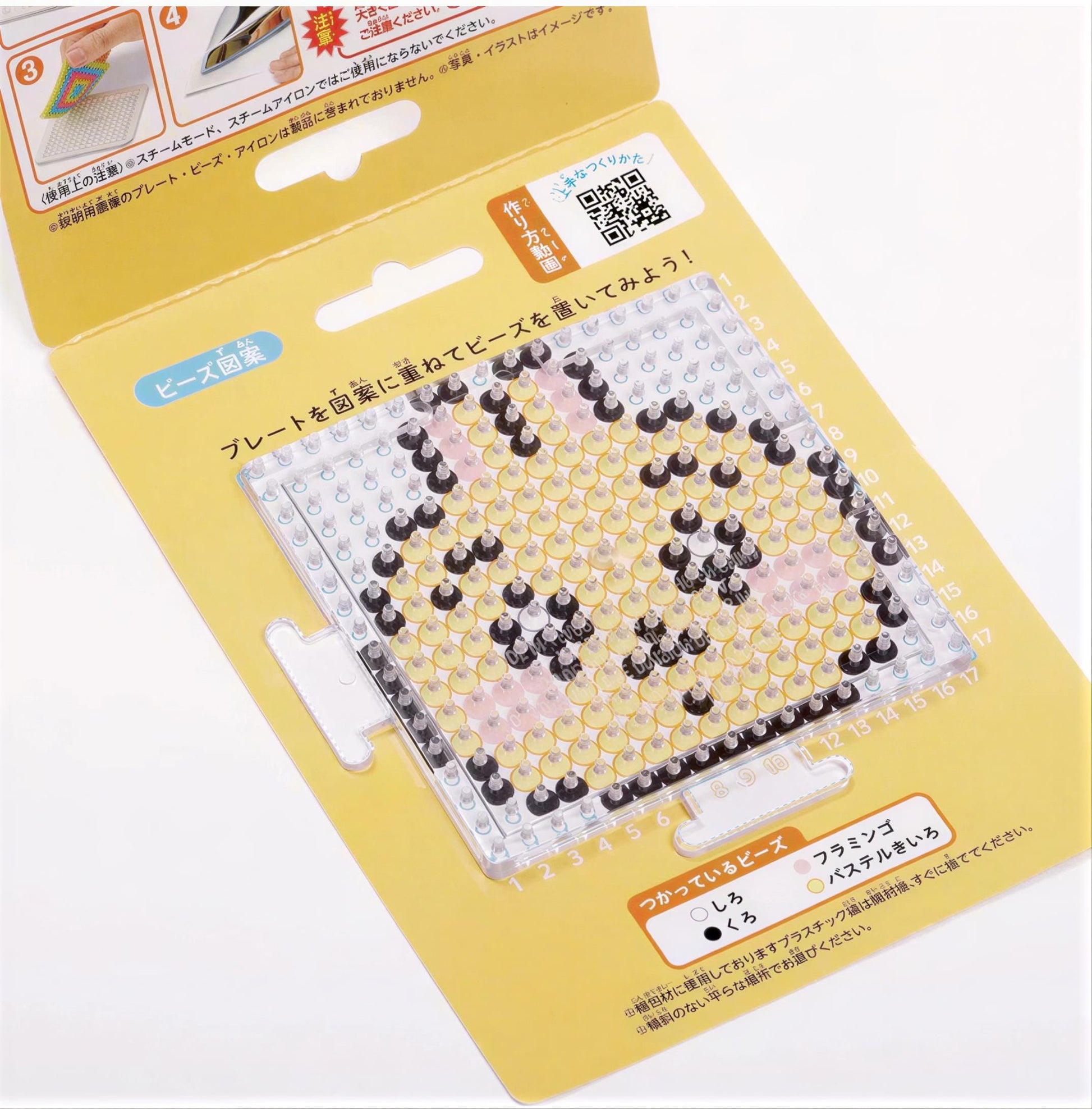 a yellow and white packaging for a product, likely a craft or art supply, with a clear plastic window that allows a view of the product inside.