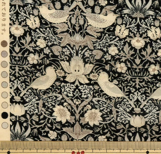 a detailed and intricate black and white floral pattern with various birds and flowers throughout the design.