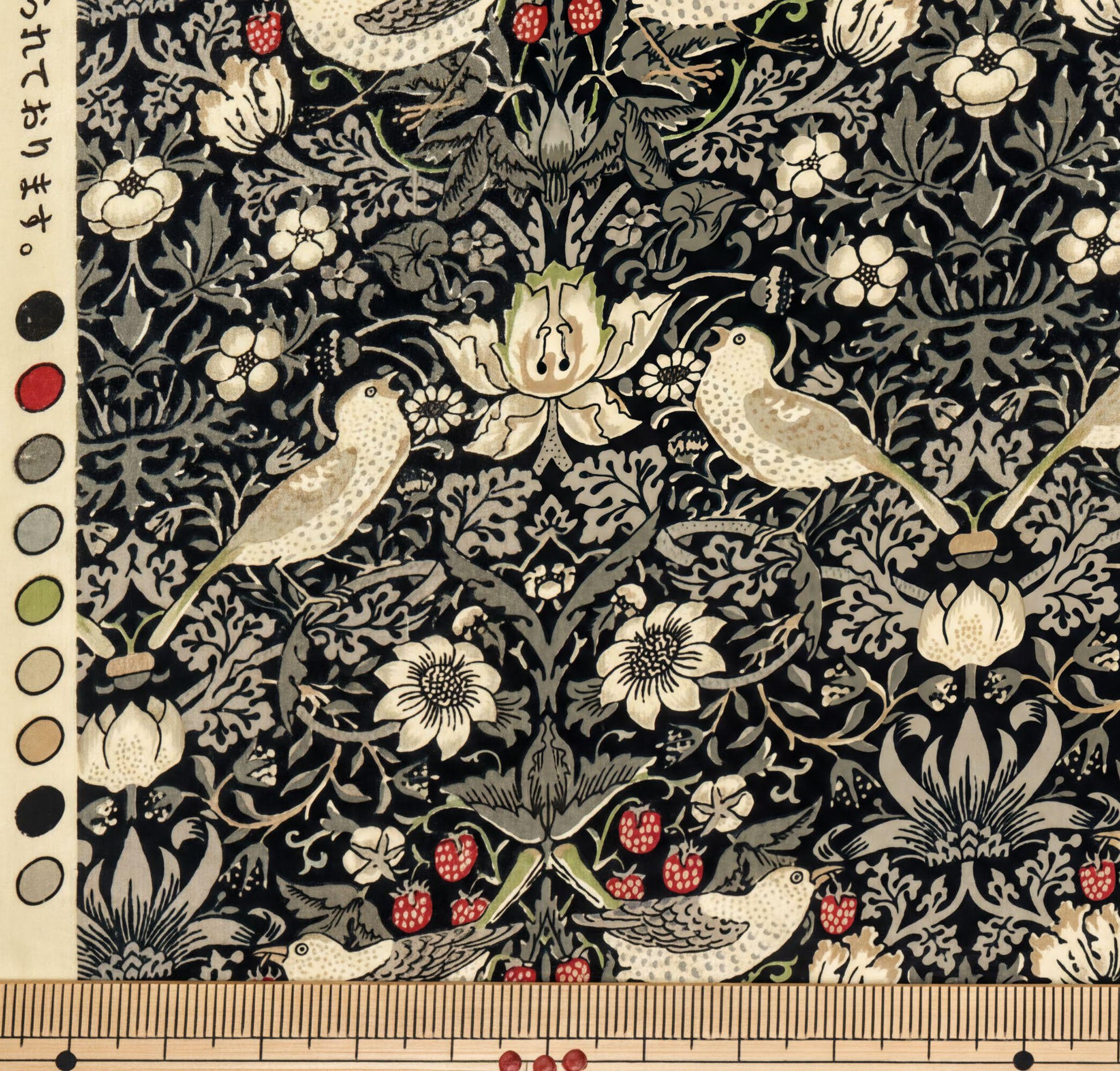 a detailed and intricate floral and bird pattern, with various shades of green, white, and red. The pattern includes flowers, leaves, and birds, creating a visually appealing and harmonious design.