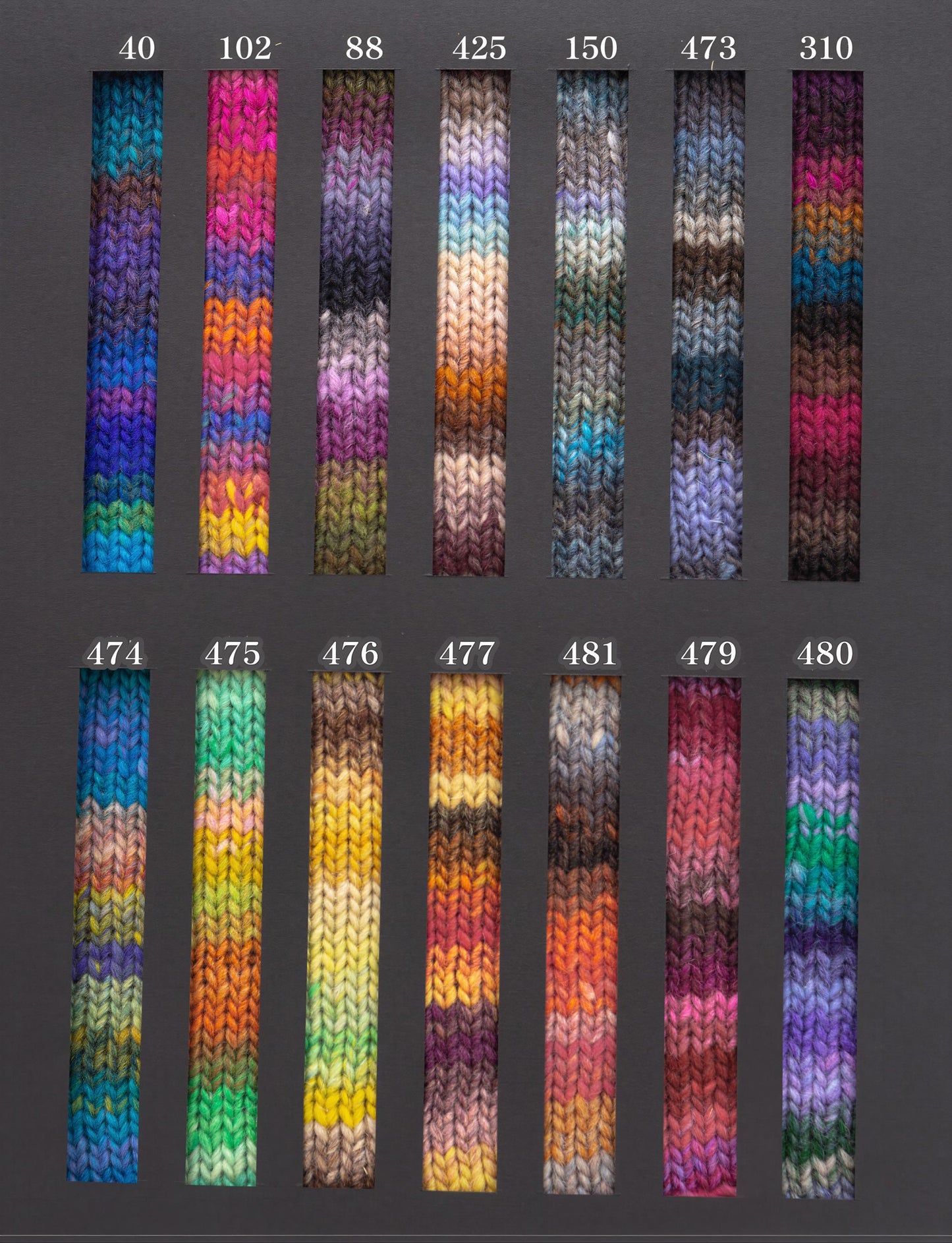 a collection of colorful knitted or crocheted fabric swatches, each with a unique pattern and color scheme.