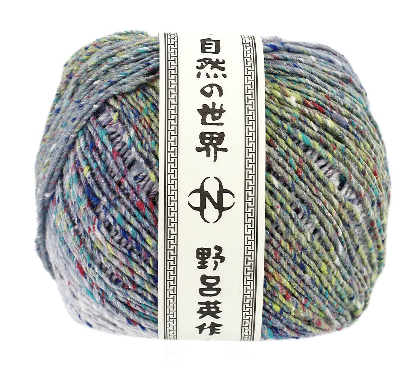 A ball of multicolored yarn with a label that includes Japanese text.