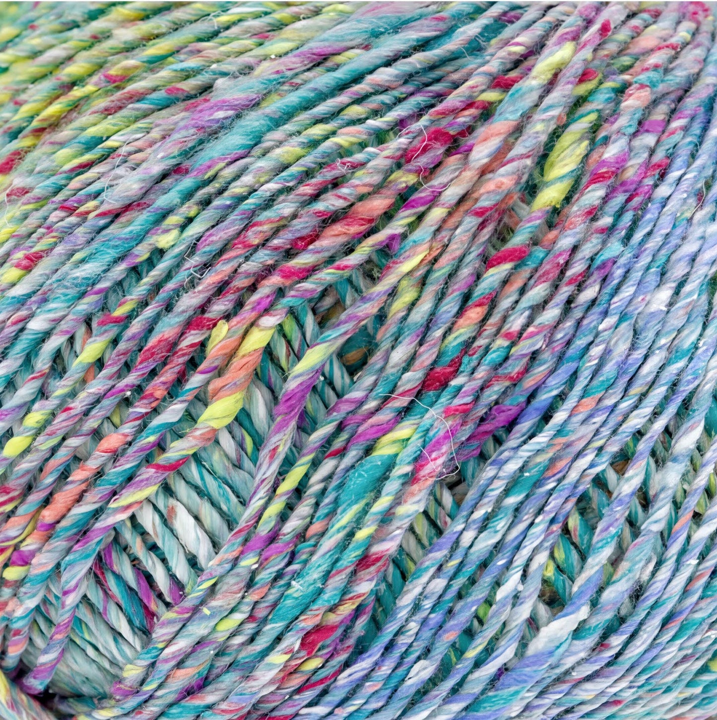 a close-up view of a ball of multicolored yarn with a vibrant, textured appearance.