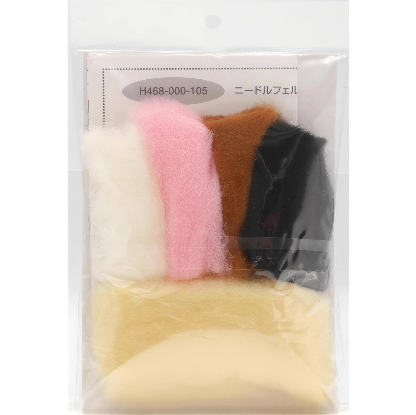 A package containing various colored felt pieces, including white, pink, brown, and black.