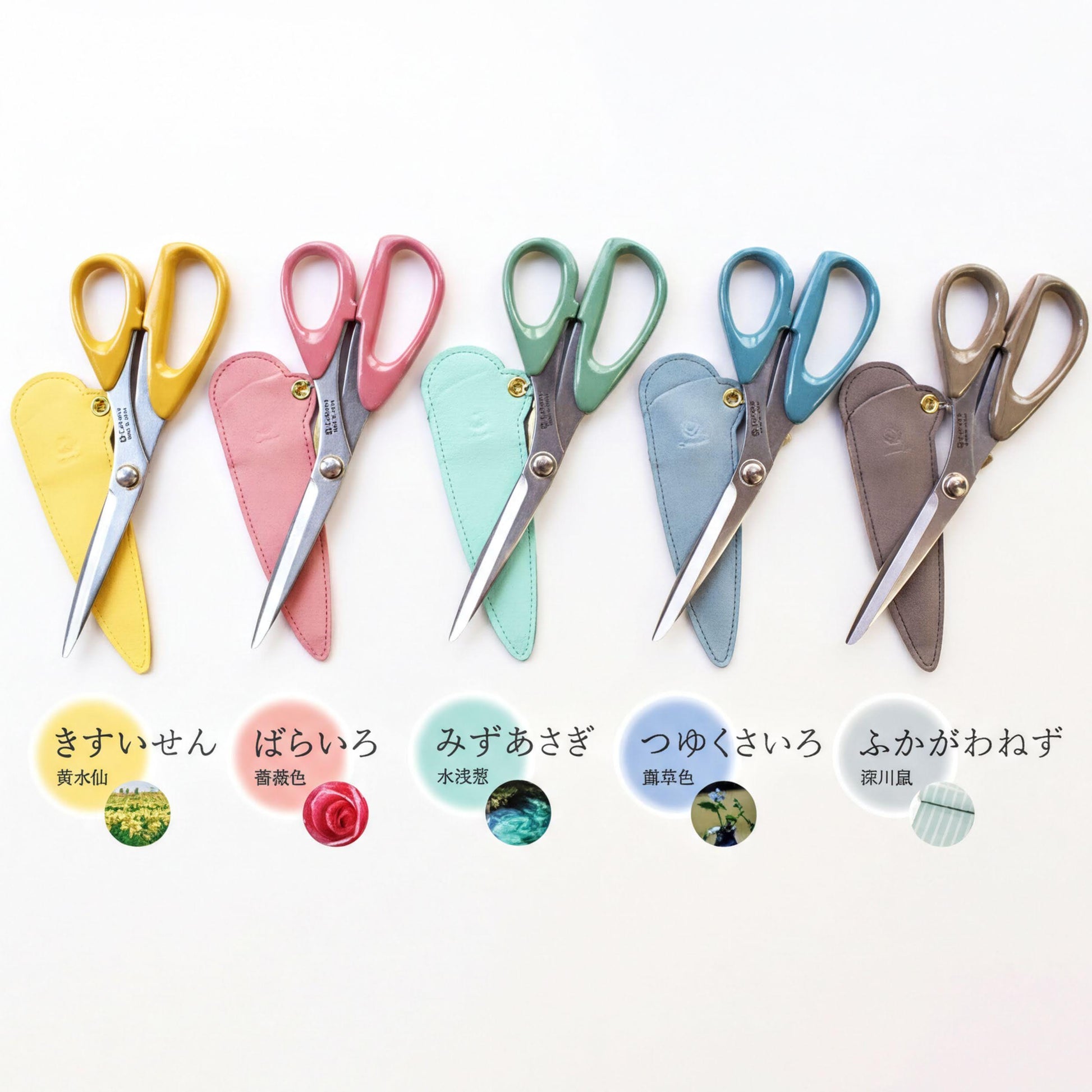a collection of colorful scissors with various designs and patterns, arranged in a row on a white background.
