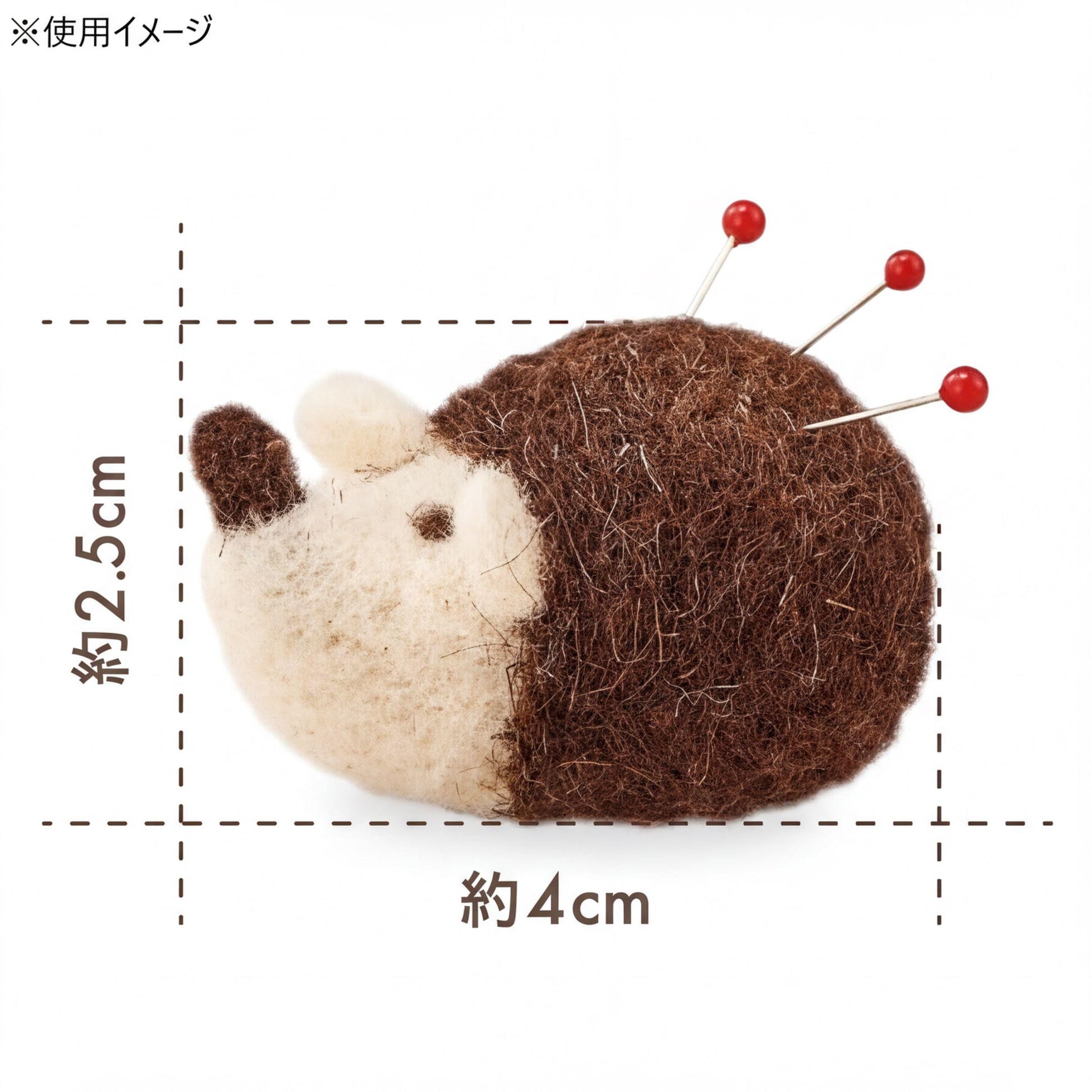 A stuffed hedgehog-shaped pin cushion with red pins protruding from its head.
