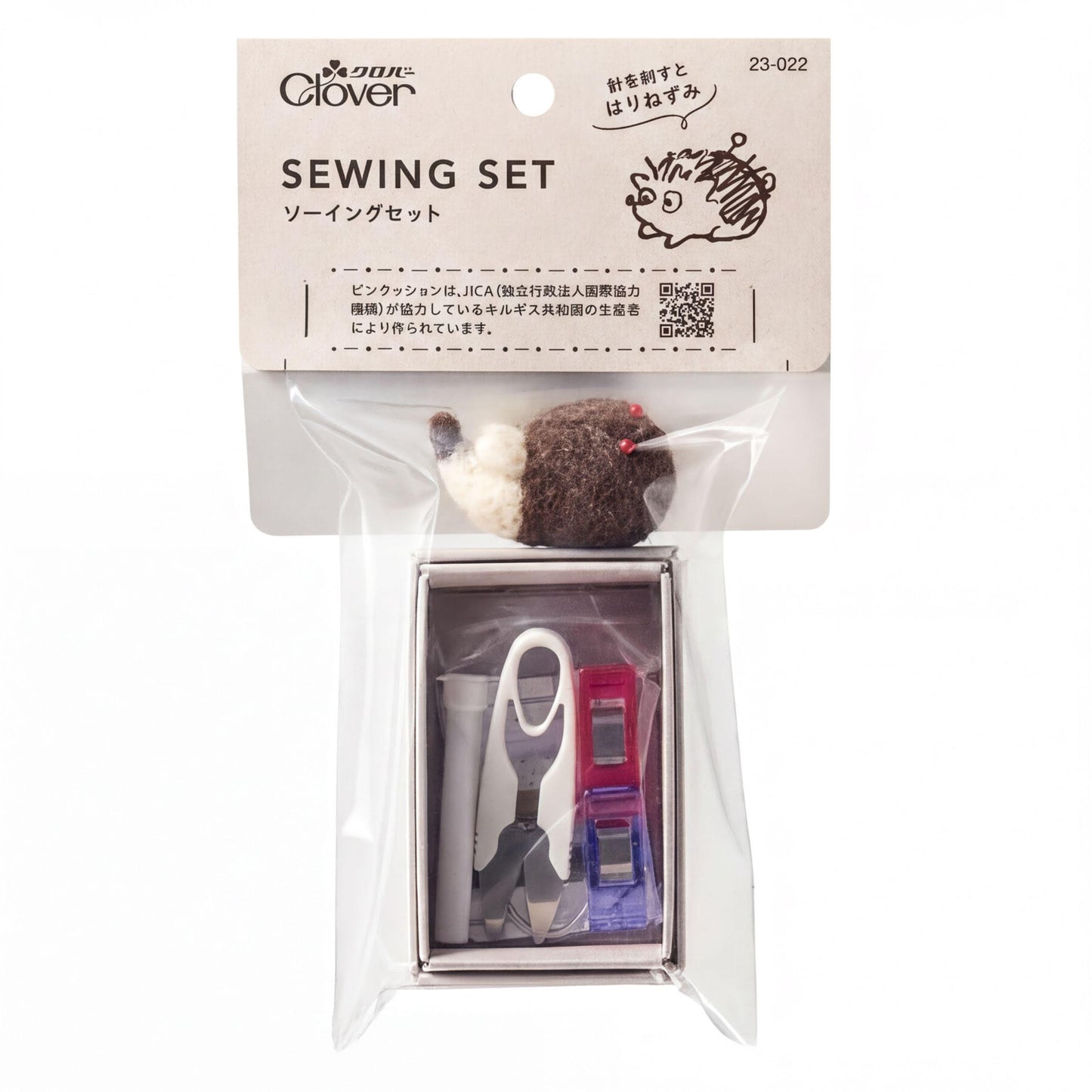 A sewing kit package with various sewing tools and accessories, including a felt mouse, scissors, and other items, all packaged in a clear plastic bag.