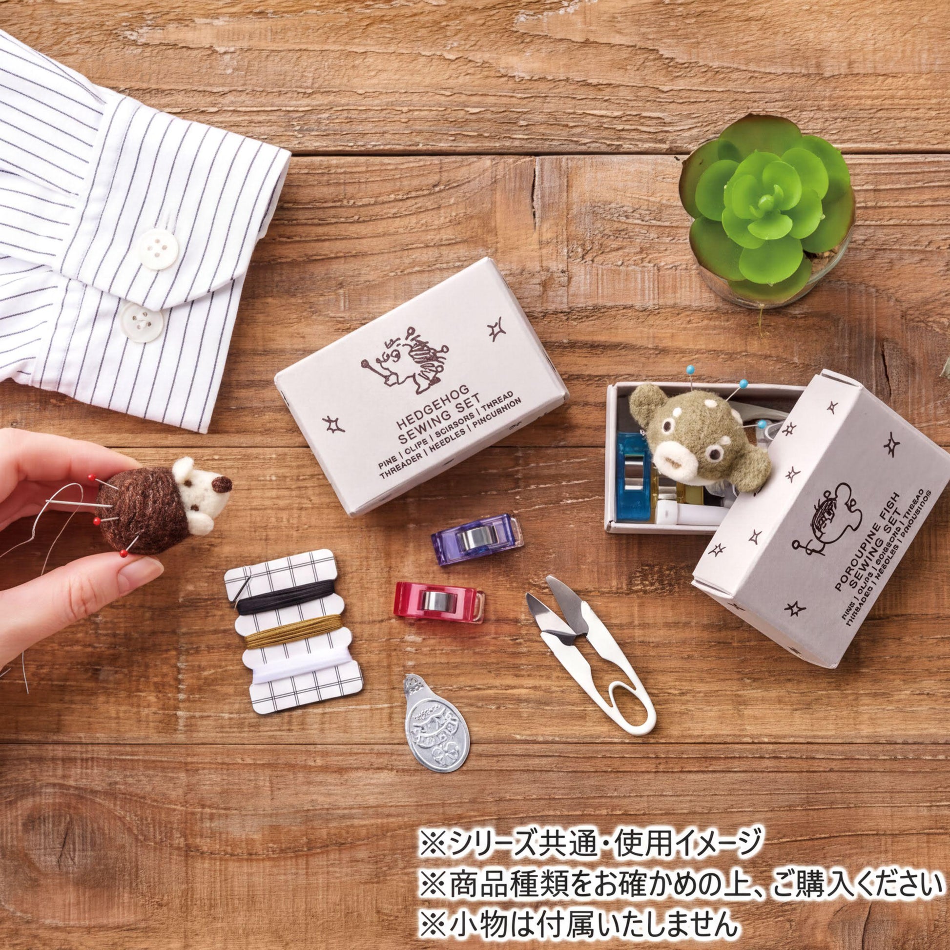 a variety of craft supplies and a stuffed animal on a wooden surface.