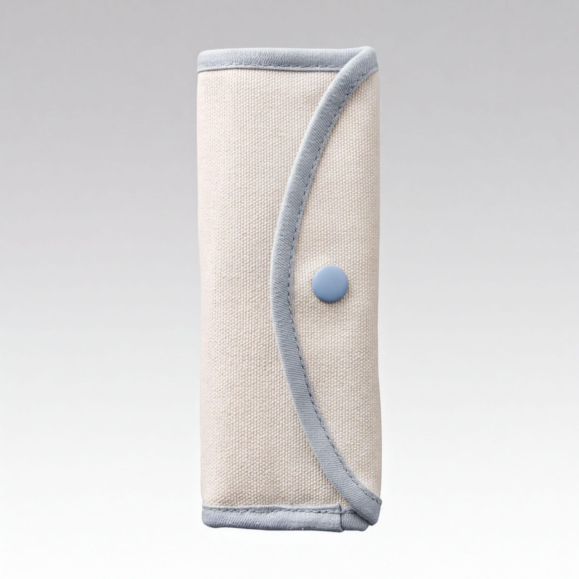 A beige cloth pouch with a blue button on it.