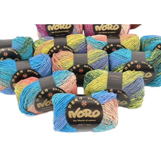 A collection of multicolored yarn balls, each with a black label that reads "NERO the World of nature".