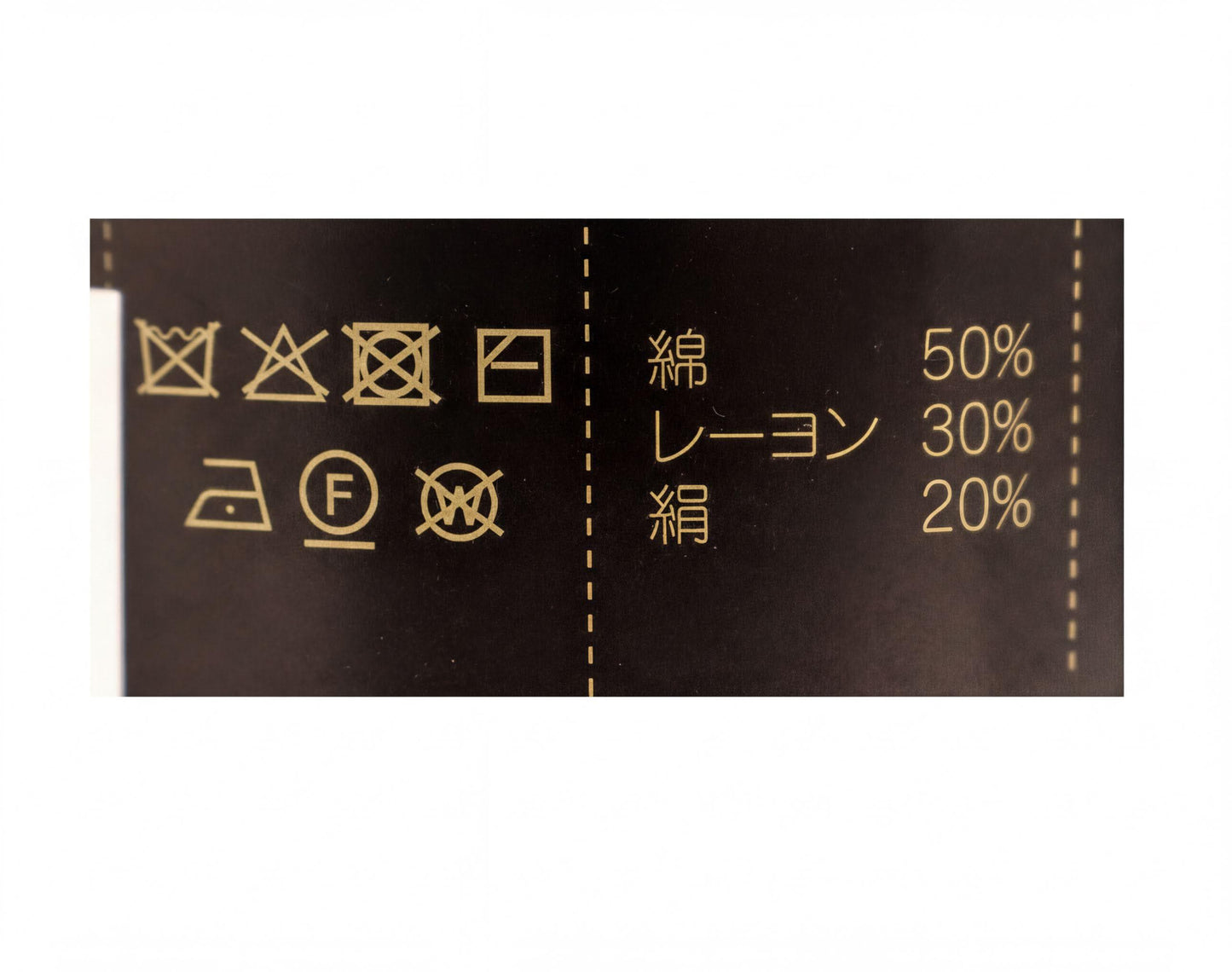 various laundry symbols and instructions, including symbols for washing, drying, ironing, and other care instructions.