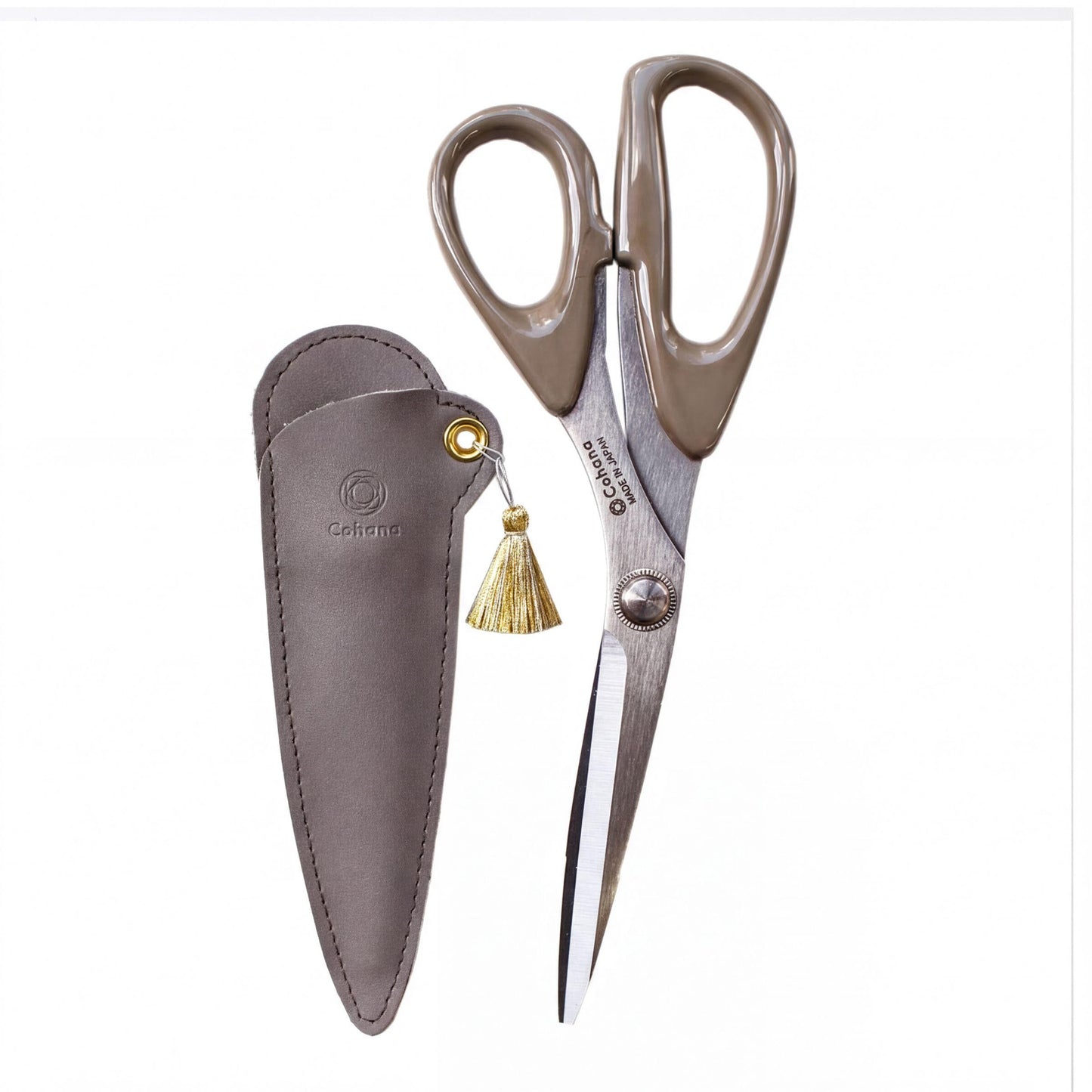 A pair of scissors with a leather pouch and a tassel hanging from the handle.