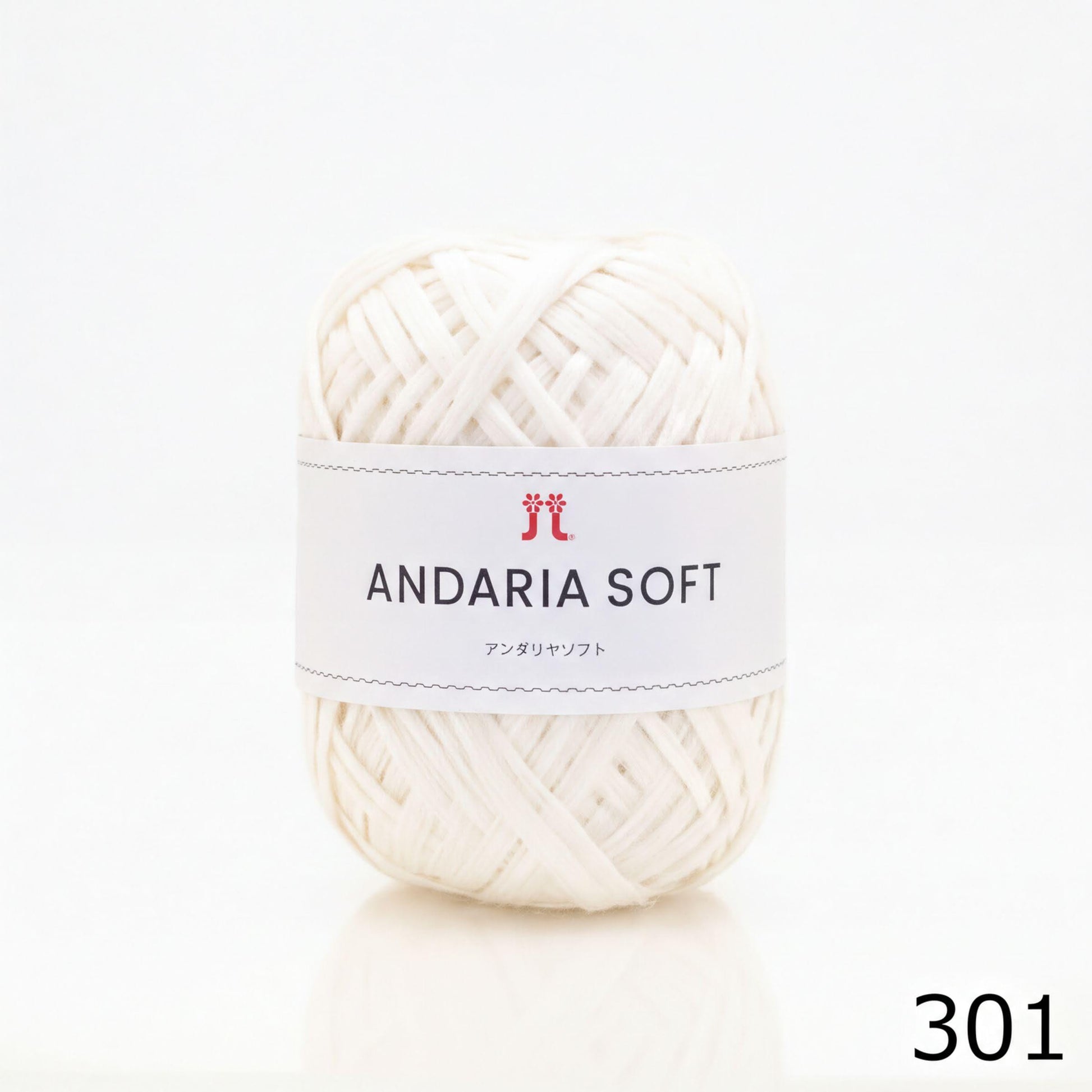 A ball of white yarn with a label that reads "ANDARIA SOFT" and "コーヒー" (Japanese for "yarn").