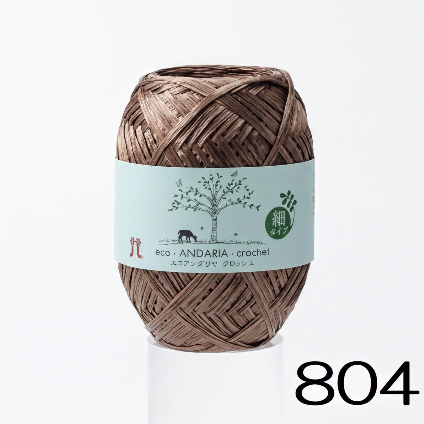 A spool of brown yarn with a label that reads "eco-ANDARIA-crochet" and features a tree illustration.