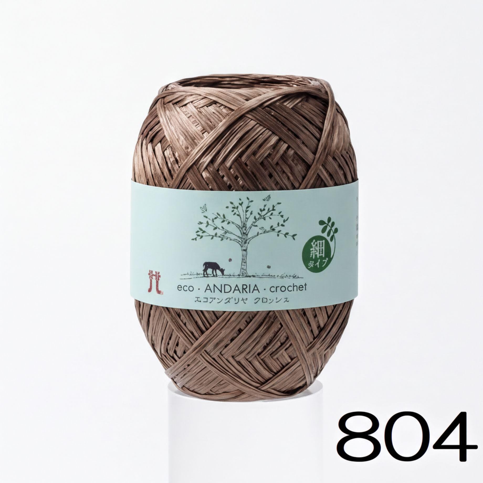 A spool of brown yarn with a label that reads "eco-ANDARIA-crochet" and features a tree illustration.
