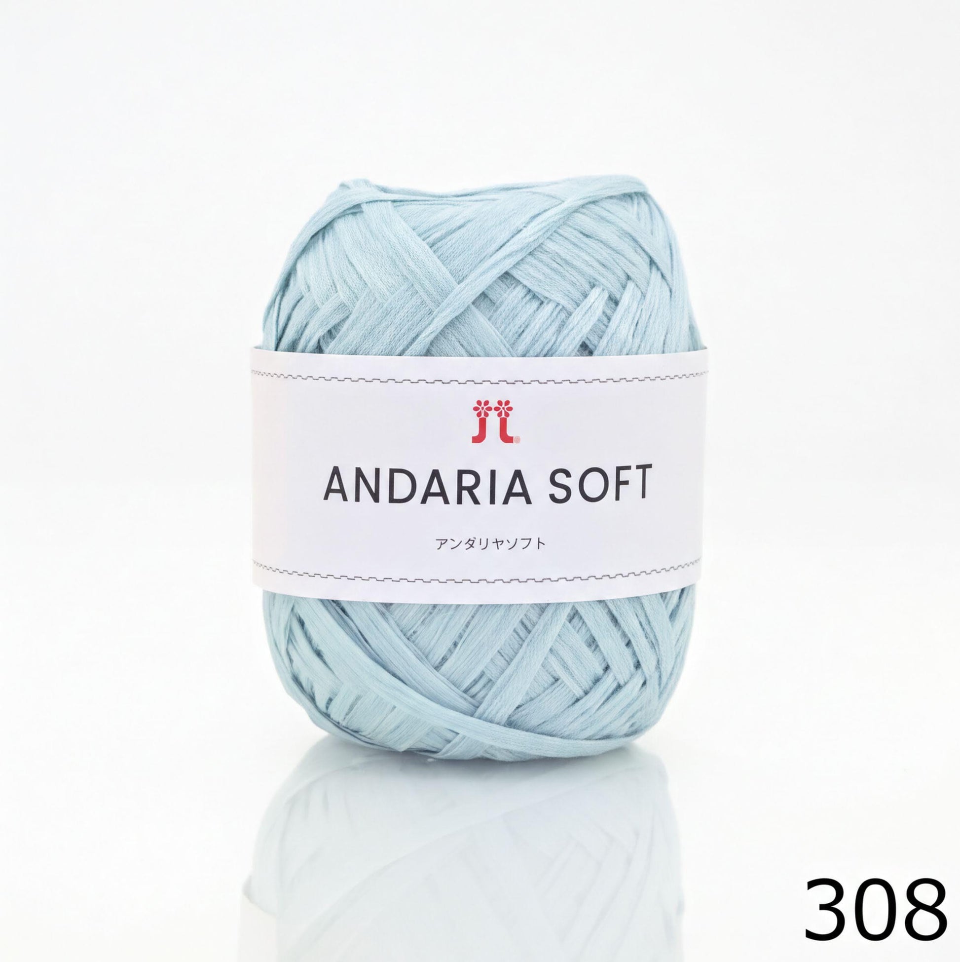 A ball of light blue yarn with a label that reads "ANDARIA SOFT" and "コーヒー" (cotton) written on it.