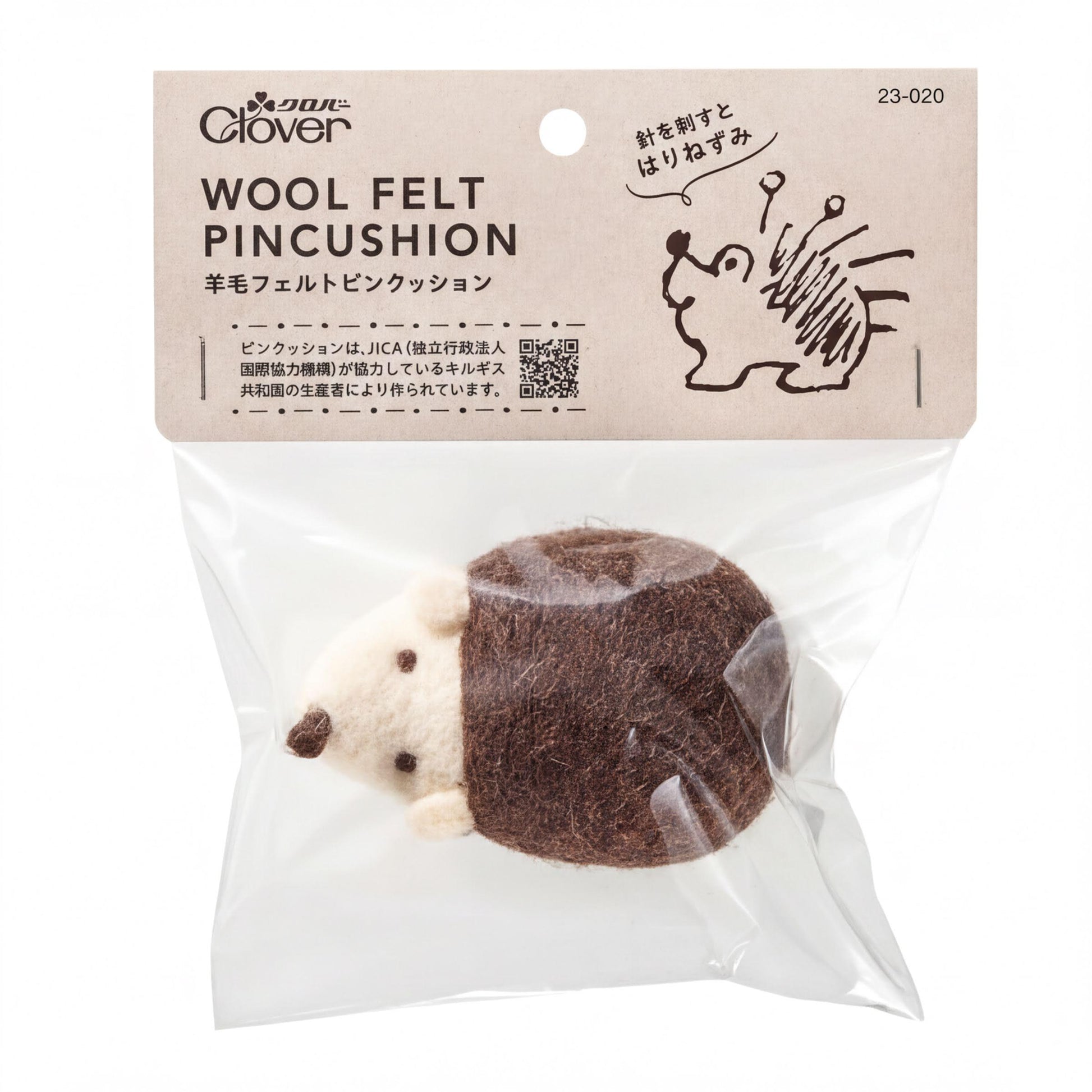 A package of wool felt pincushion toys, with a small stuffed hedgehog toy visible inside the package.