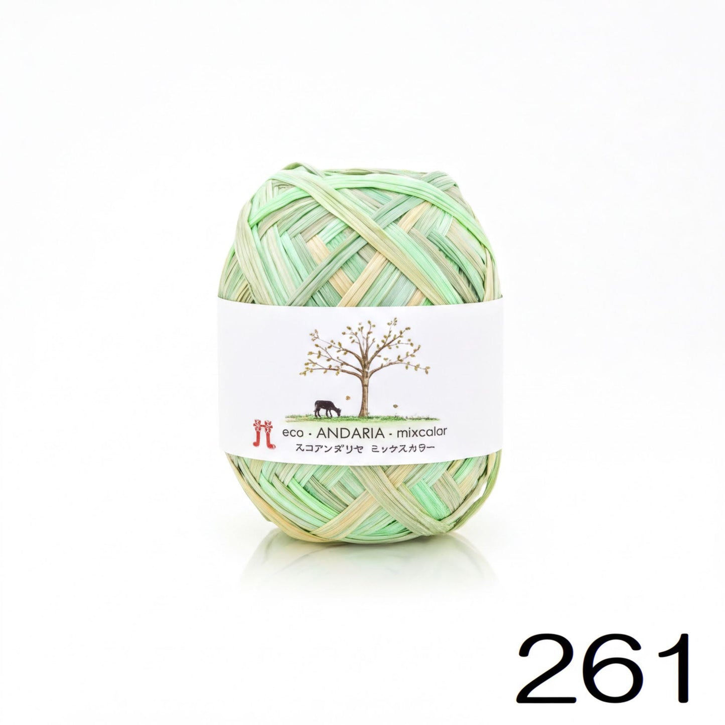 A ball of yarn with a label that includes a tree and text in Japanese.