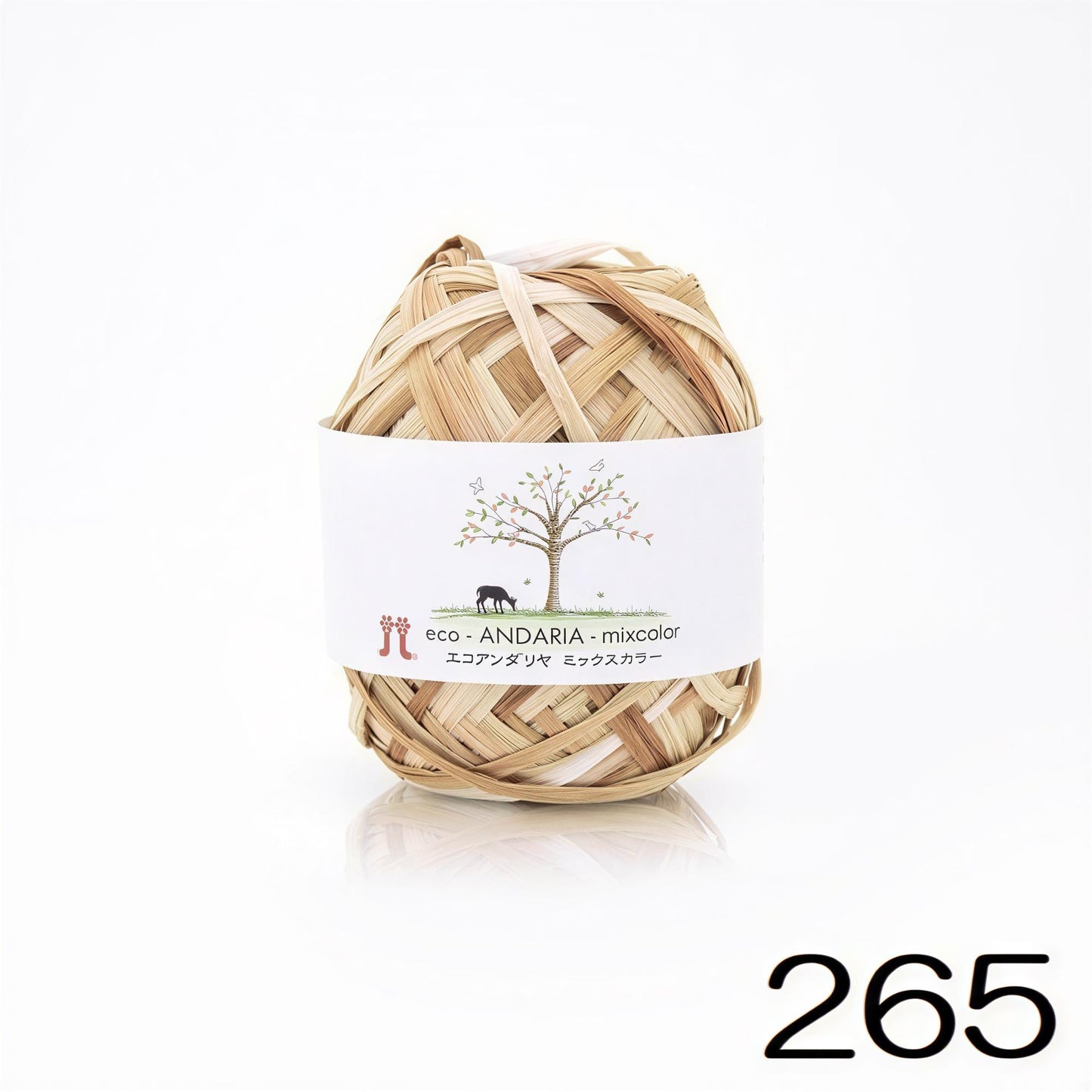 A ball of yarn wrapped in a white label with a tree design and text in Japanese.