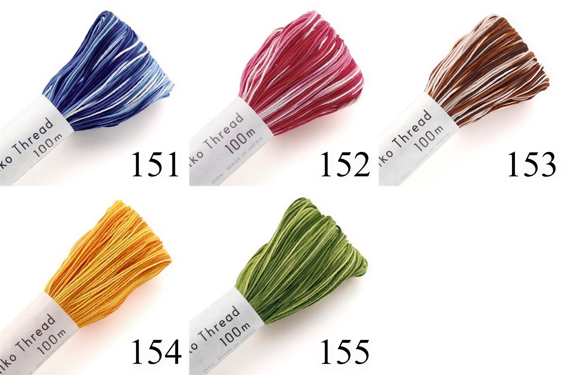 five spools of thread in various colors, each labeled with a number indicating the thread's color.