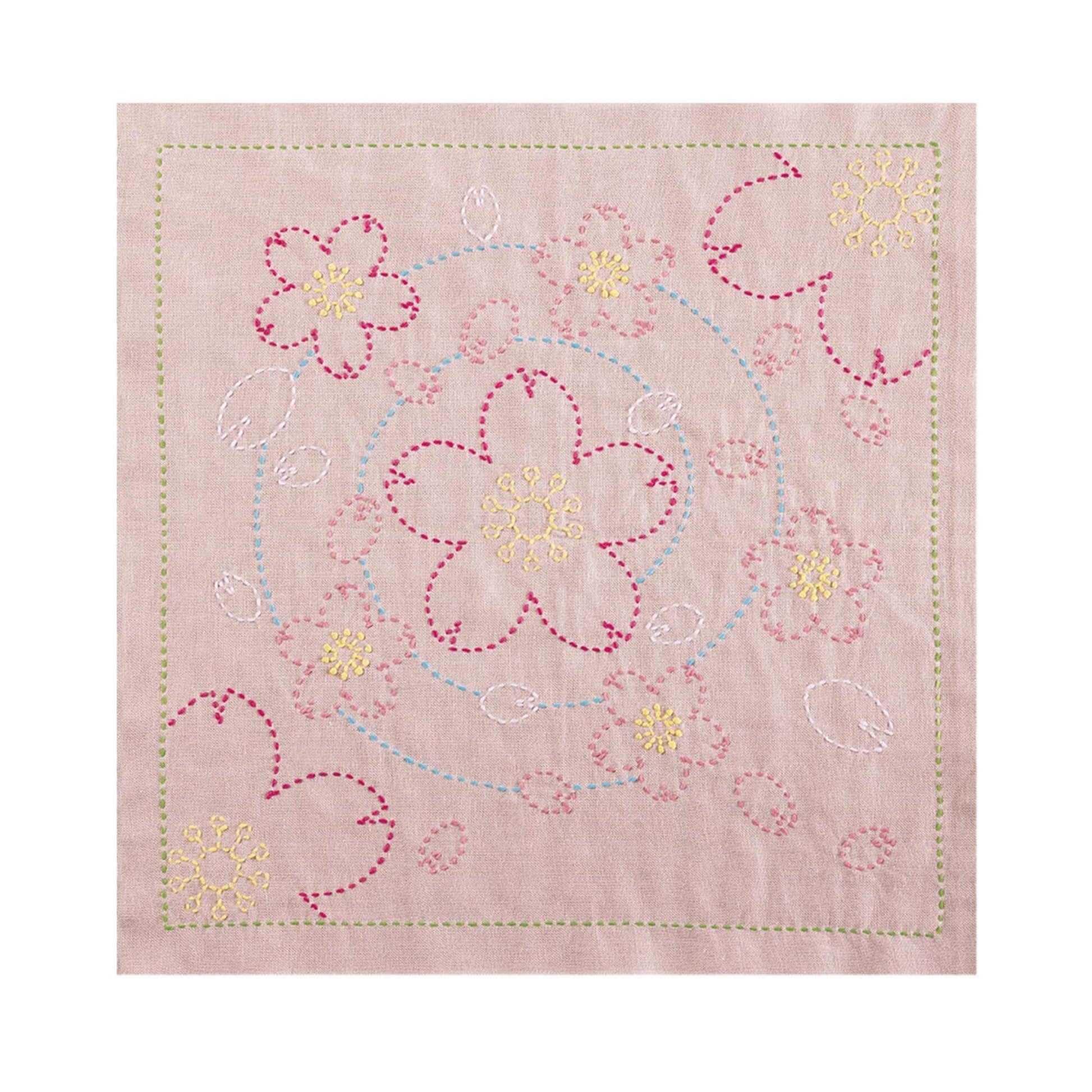 a square-shaped fabric with a floral design, including pink and yellow flowers and leaves. The design is created using a needle and thread technique, with the flowers and leaves appearing as small, intricate patterns.
