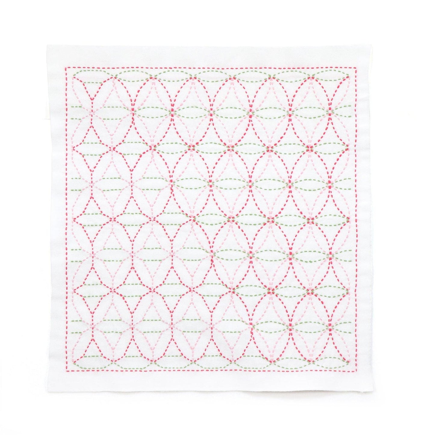 a square-shaped piece of fabric with a repeating pattern of red and green circles and lines, creating a visually striking and intricate design.