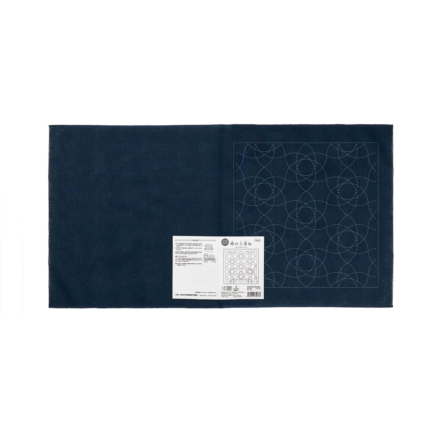 a dark blue fabric with a white label attached to it, which appears to be a sewing or crafting material.