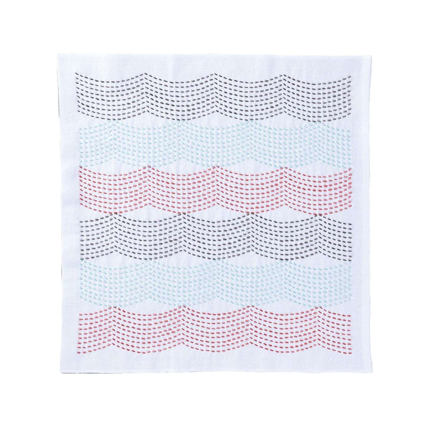 a white fabric with a repeating pattern of wavy lines in various colors, including red, blue, and gray.