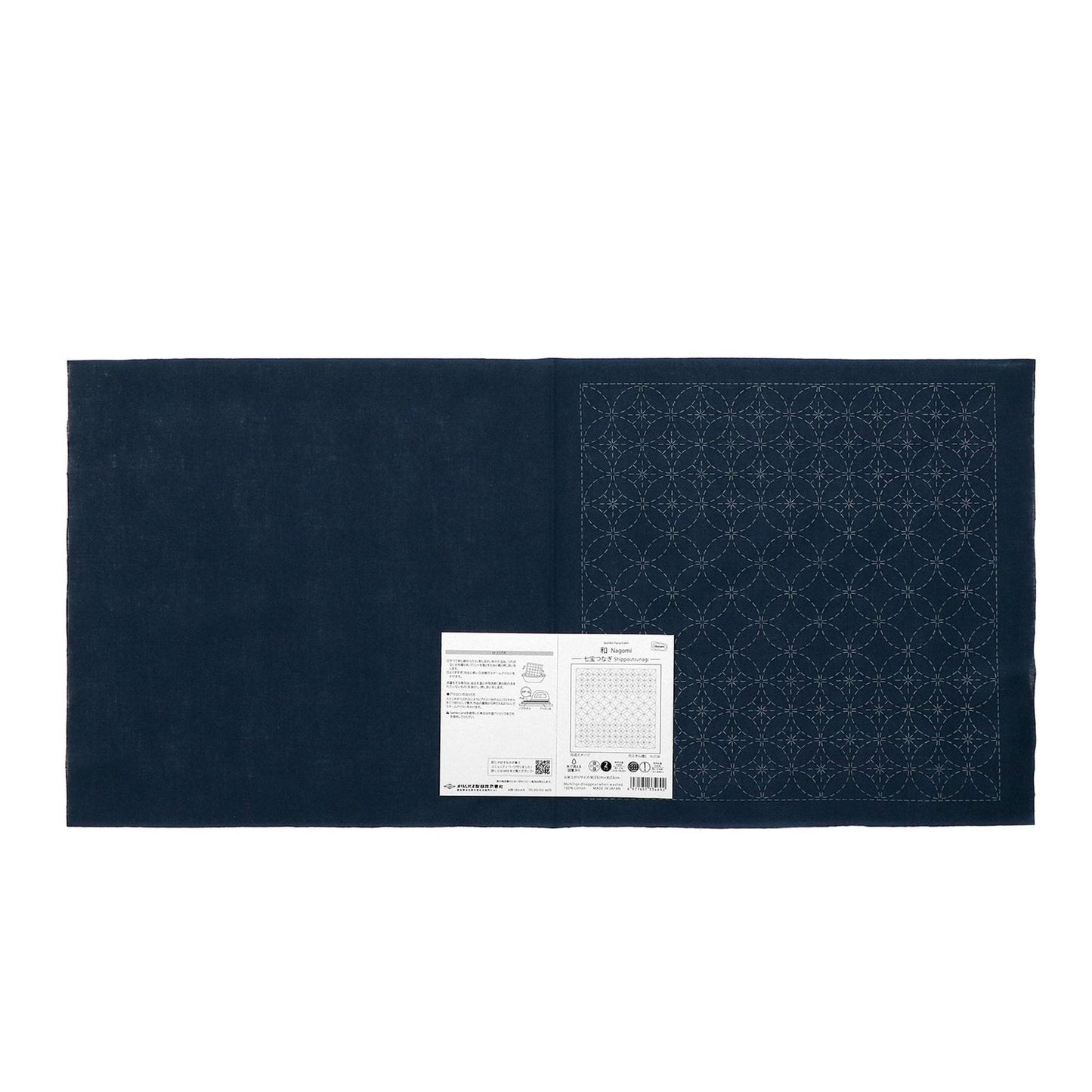 The image is a dark blue fabric with a white label attached to it, which appears to be a sewing or crafting material.