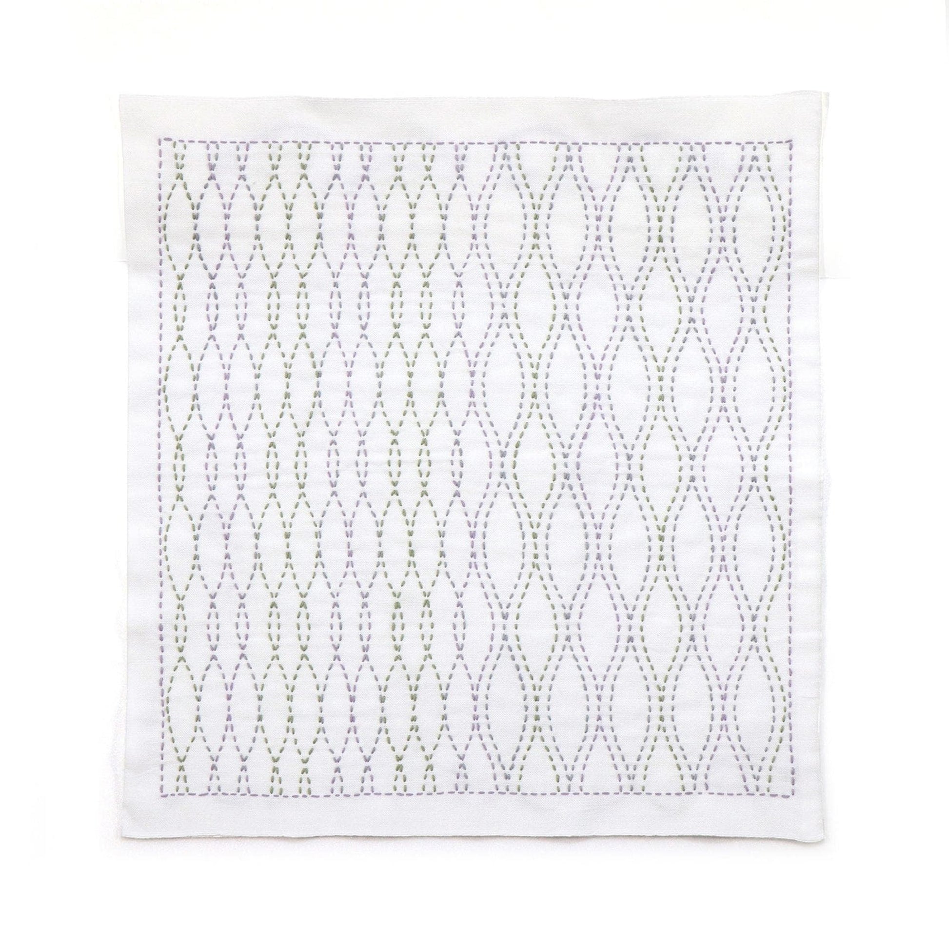 a square-shaped fabric with a repeating pattern of green and purple lines, creating a visually striking and intricate design.