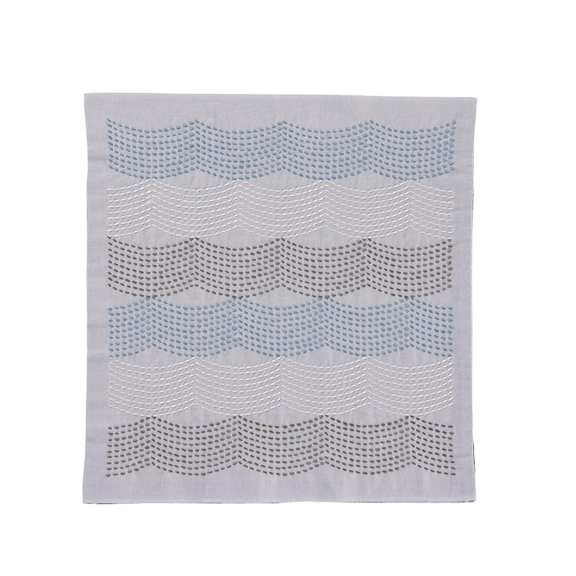 a gray fabric with a wavy pattern of small circles or dots arranged in a repeating diagonal line across the fabric.