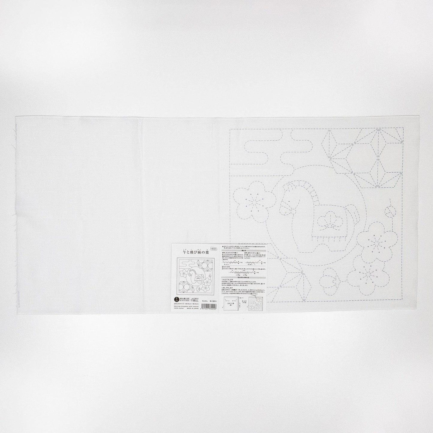 The image is a white piece of paper with a black and white illustration of a horse and flowers.