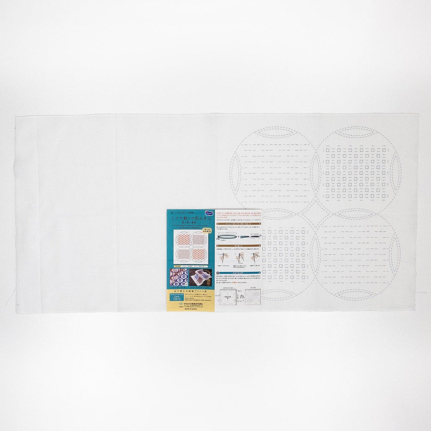 The image is a white sheet of paper with various printed materials, including a diagram and some text.