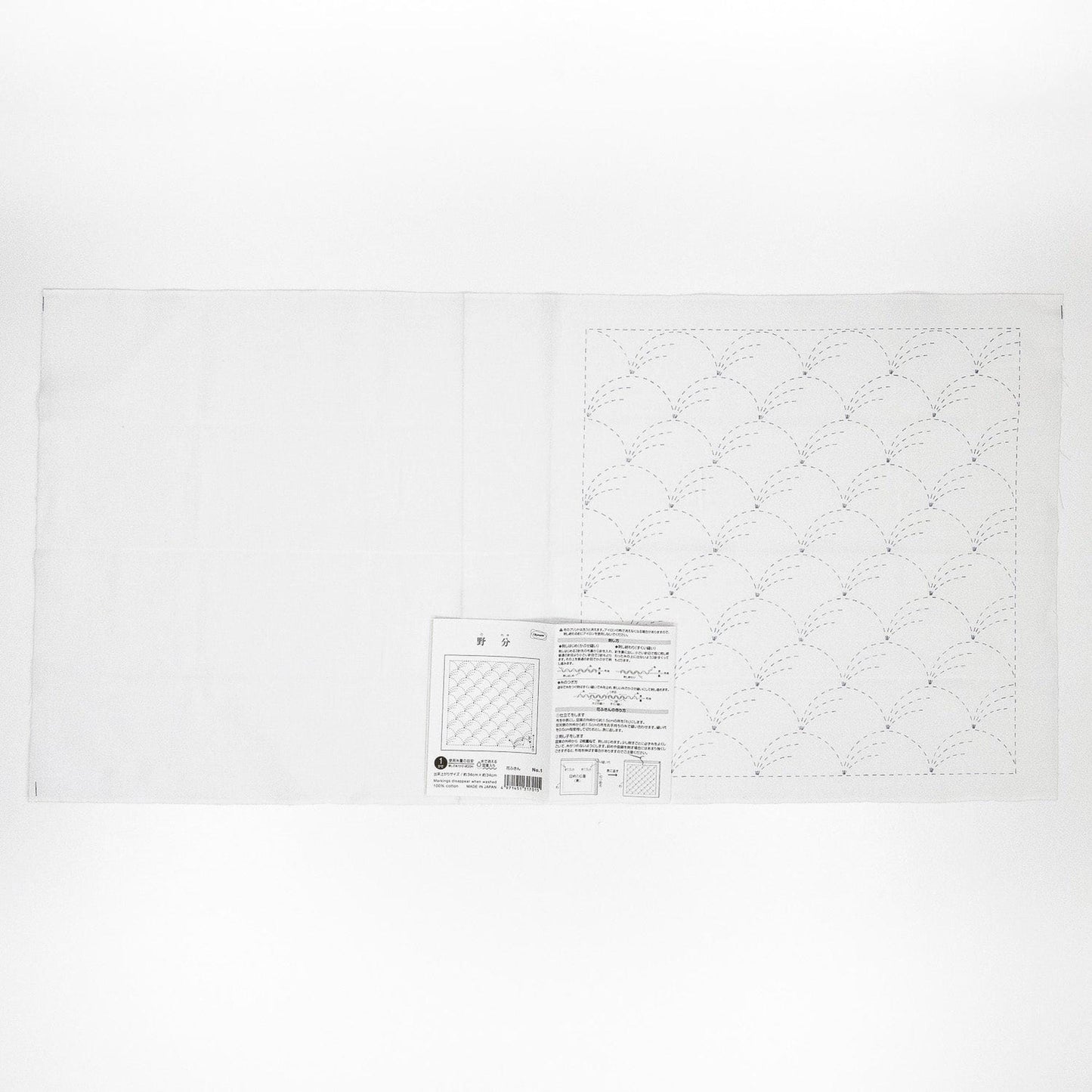 The image is a plain white sheet of paper with a printed pattern or design on it.