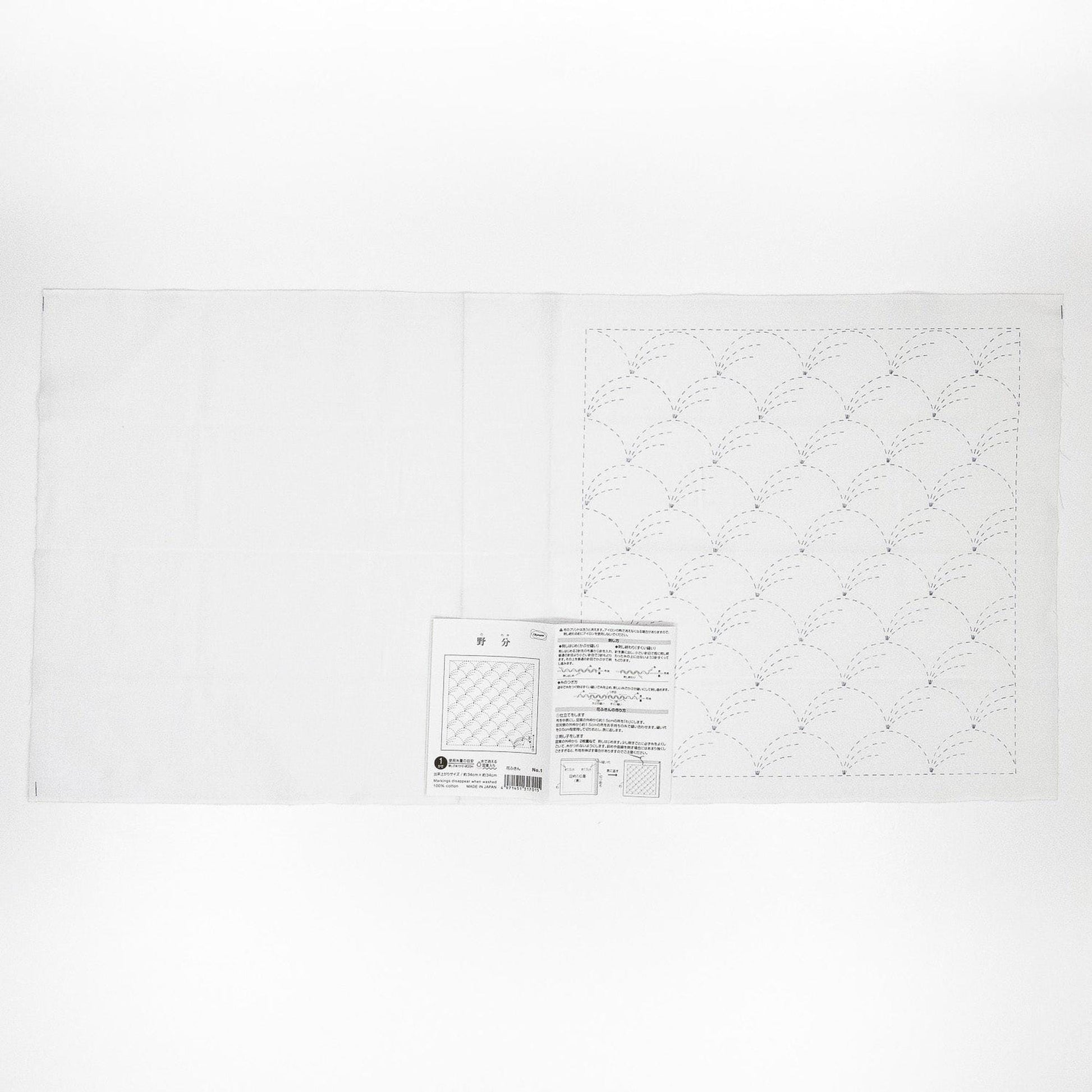 The image is a plain white sheet of paper with a printed pattern or design on it.