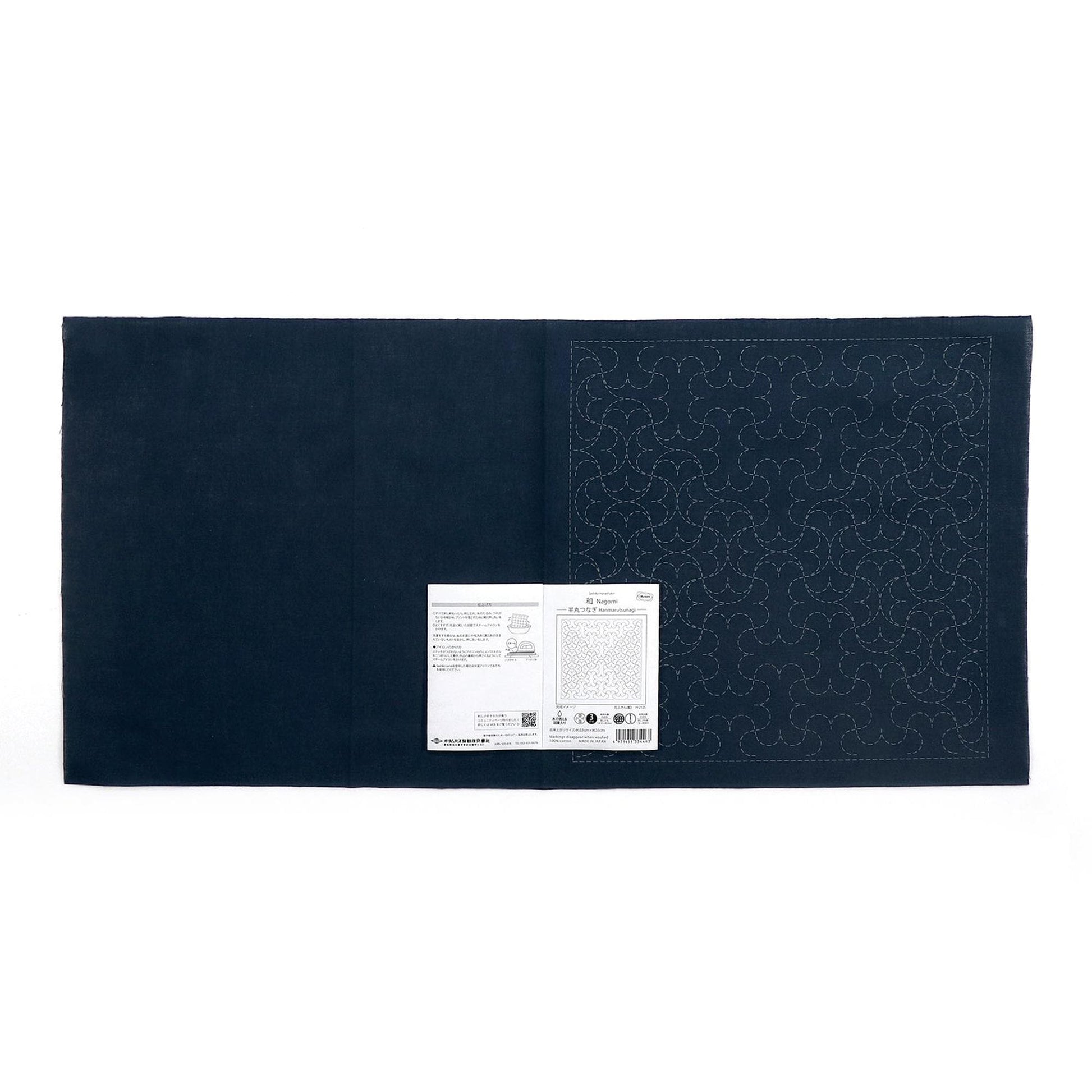The image is a black square with a white label attached to it, which appears to be a sewing pattern or instructions.