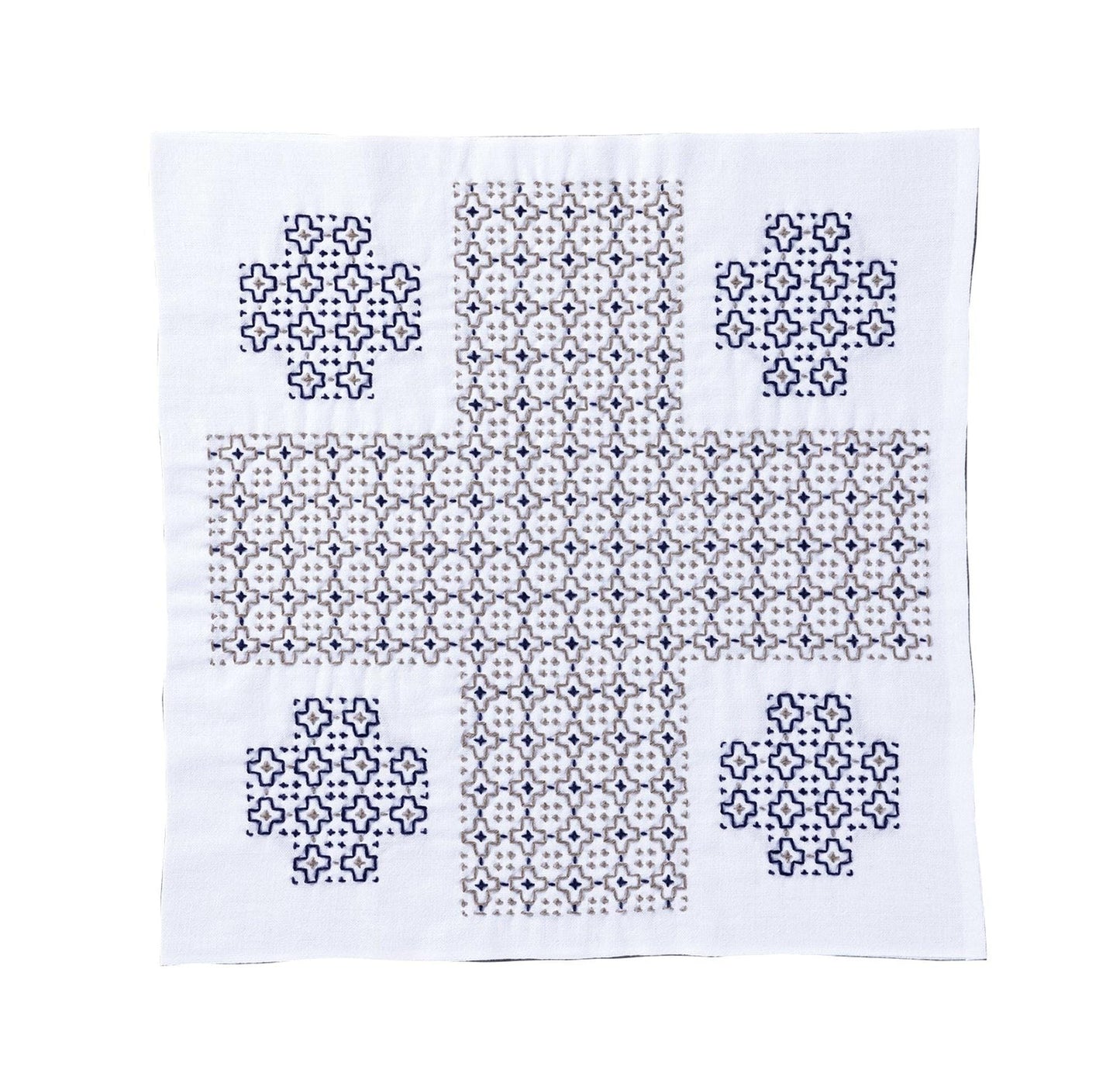 a square piece of fabric with a repeating pattern of small blue and white shapes, creating a visually striking design.