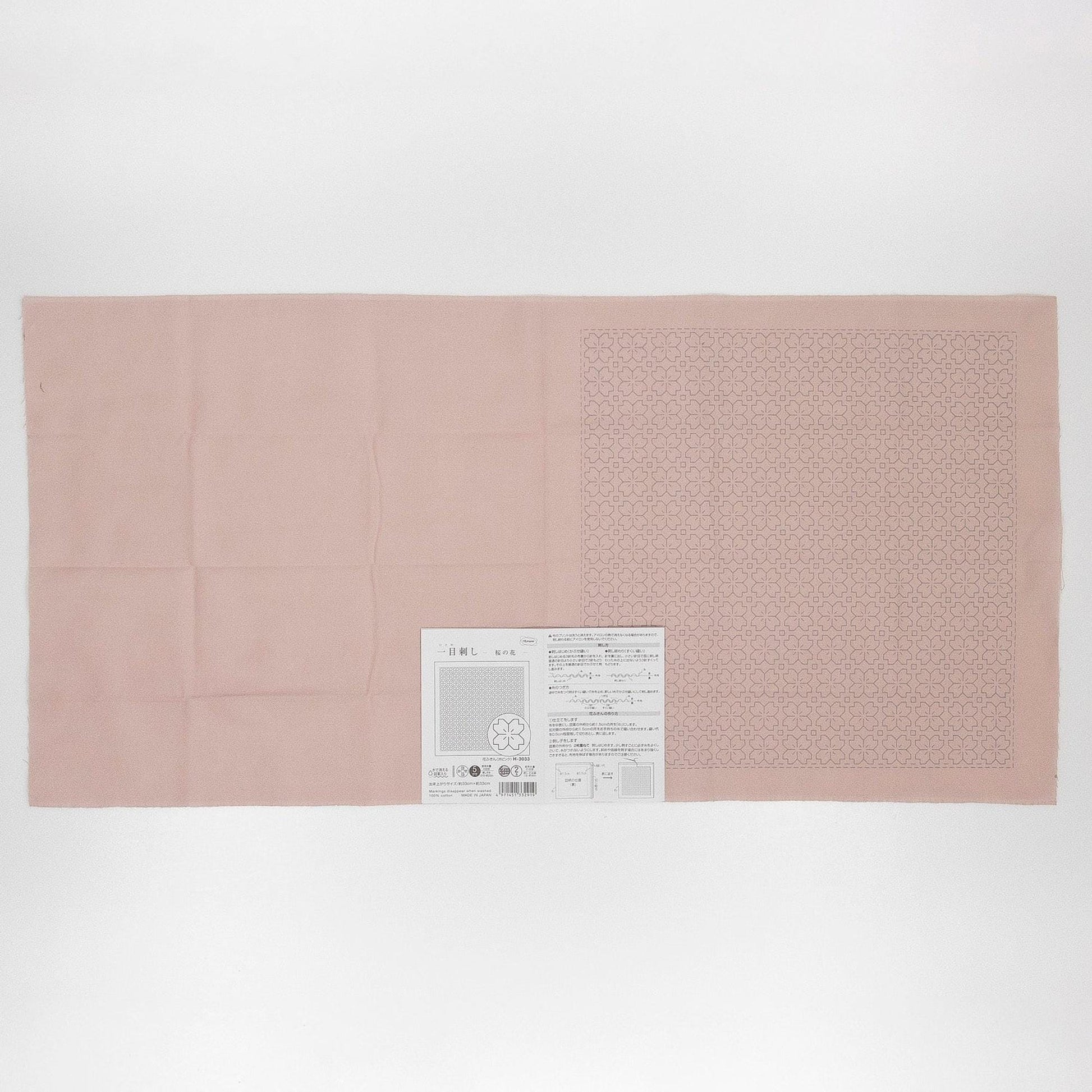 The image is a single, large pink fabric with a printed pattern on it.